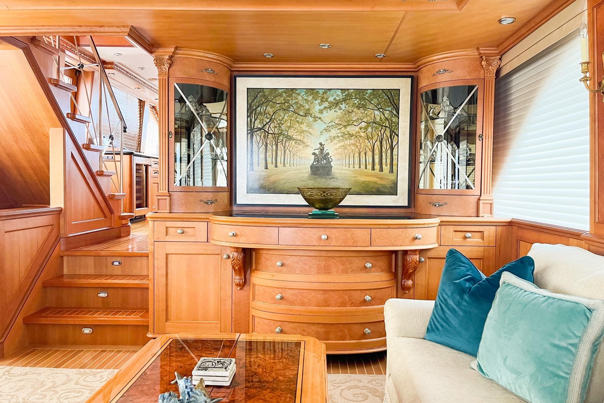 Luxurious Main Salon interior with elegant woodwork and artwork.
