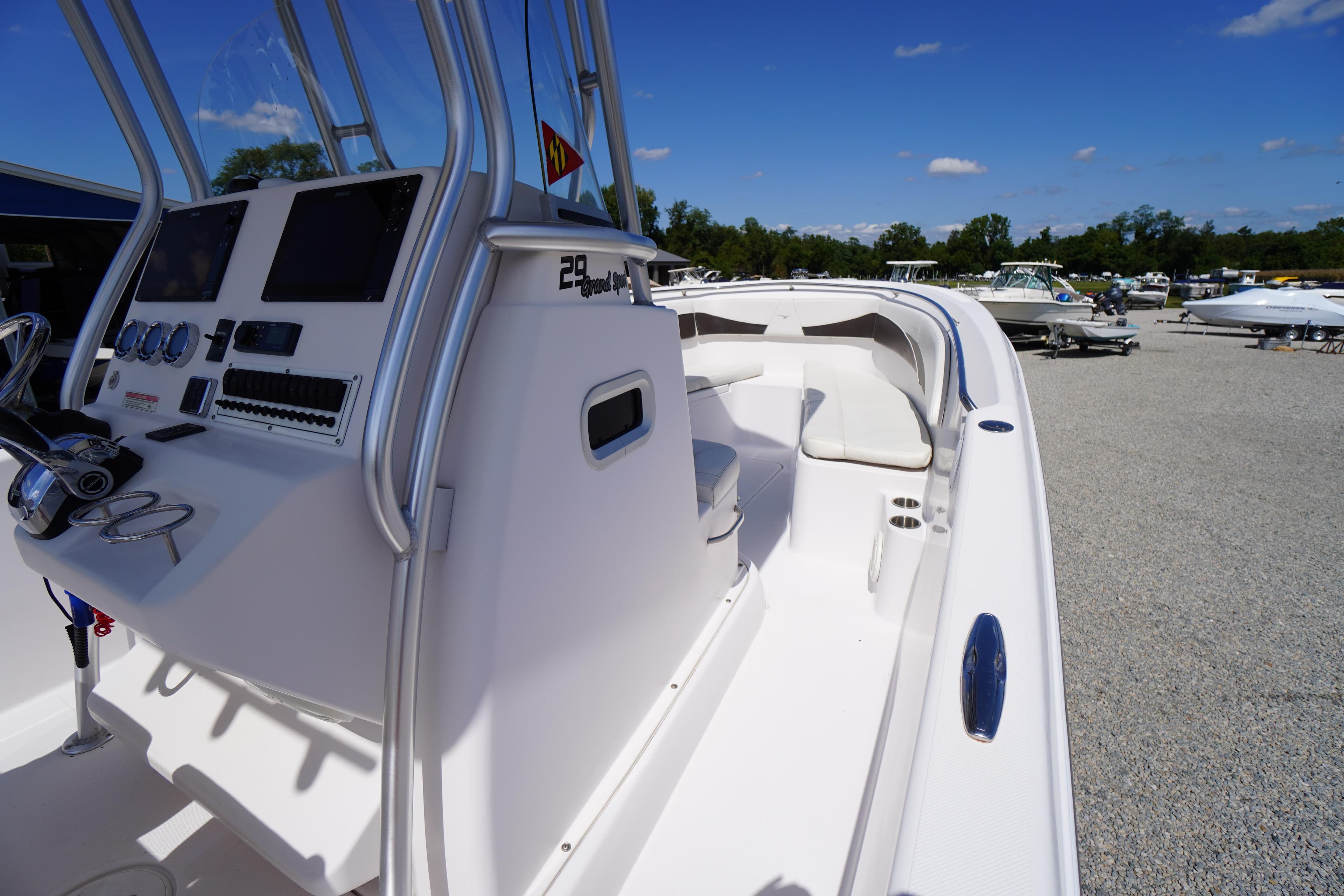 2016 Pro-Line 29 Grand Sport boat with sleek design and modern cockpit controls.
