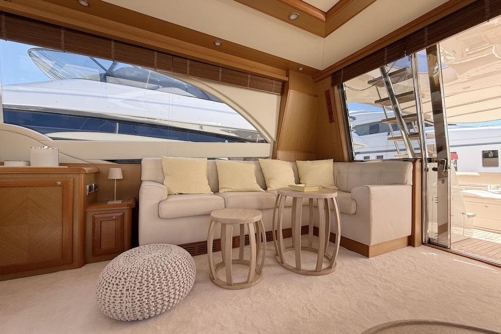 Luxurious interior of 2008 Mochi Craft 64' Dolphin yacht with elegant seating and decor.