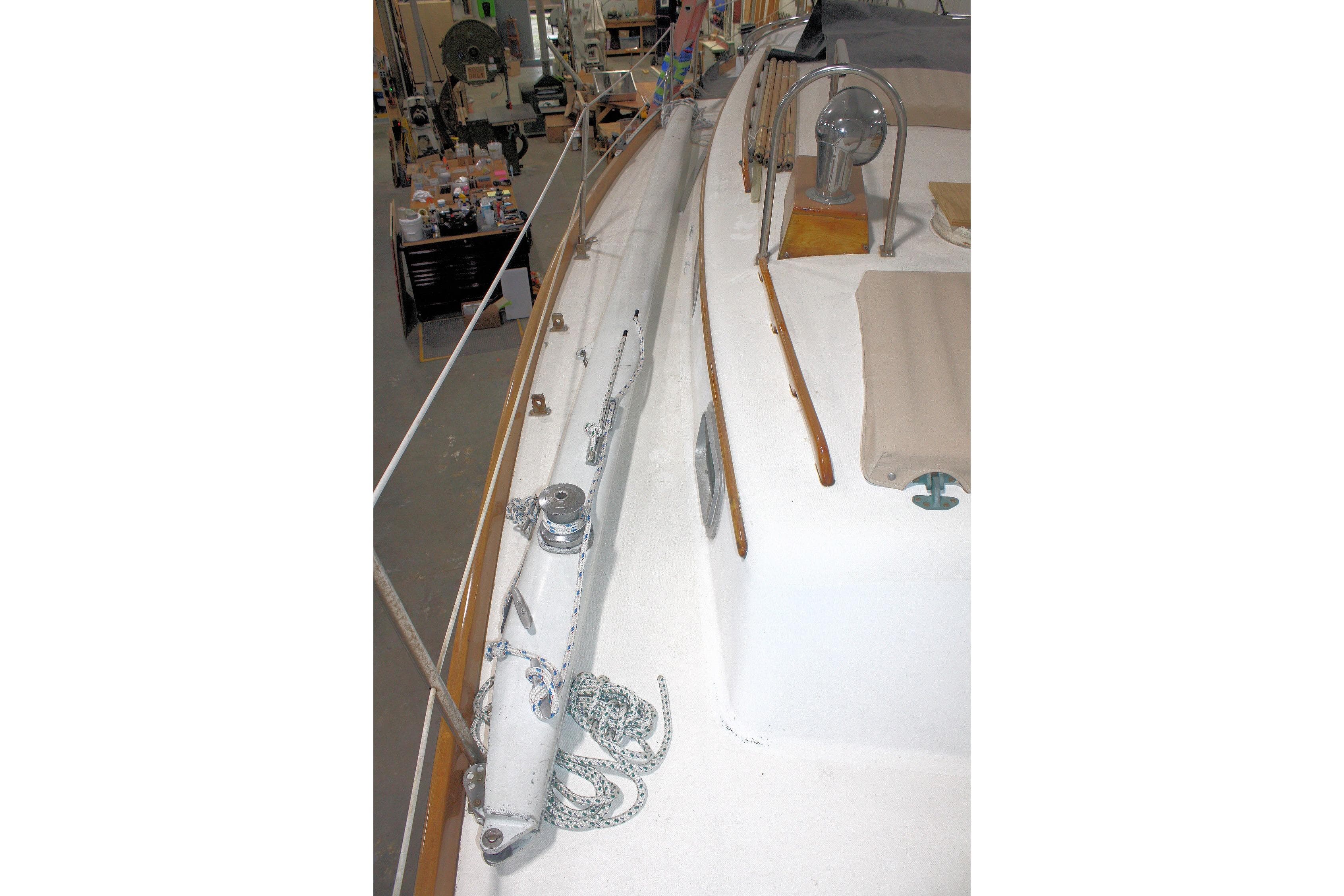 1981 Bristol 40 sailboat deck with winch and ropes in a workshop setting.