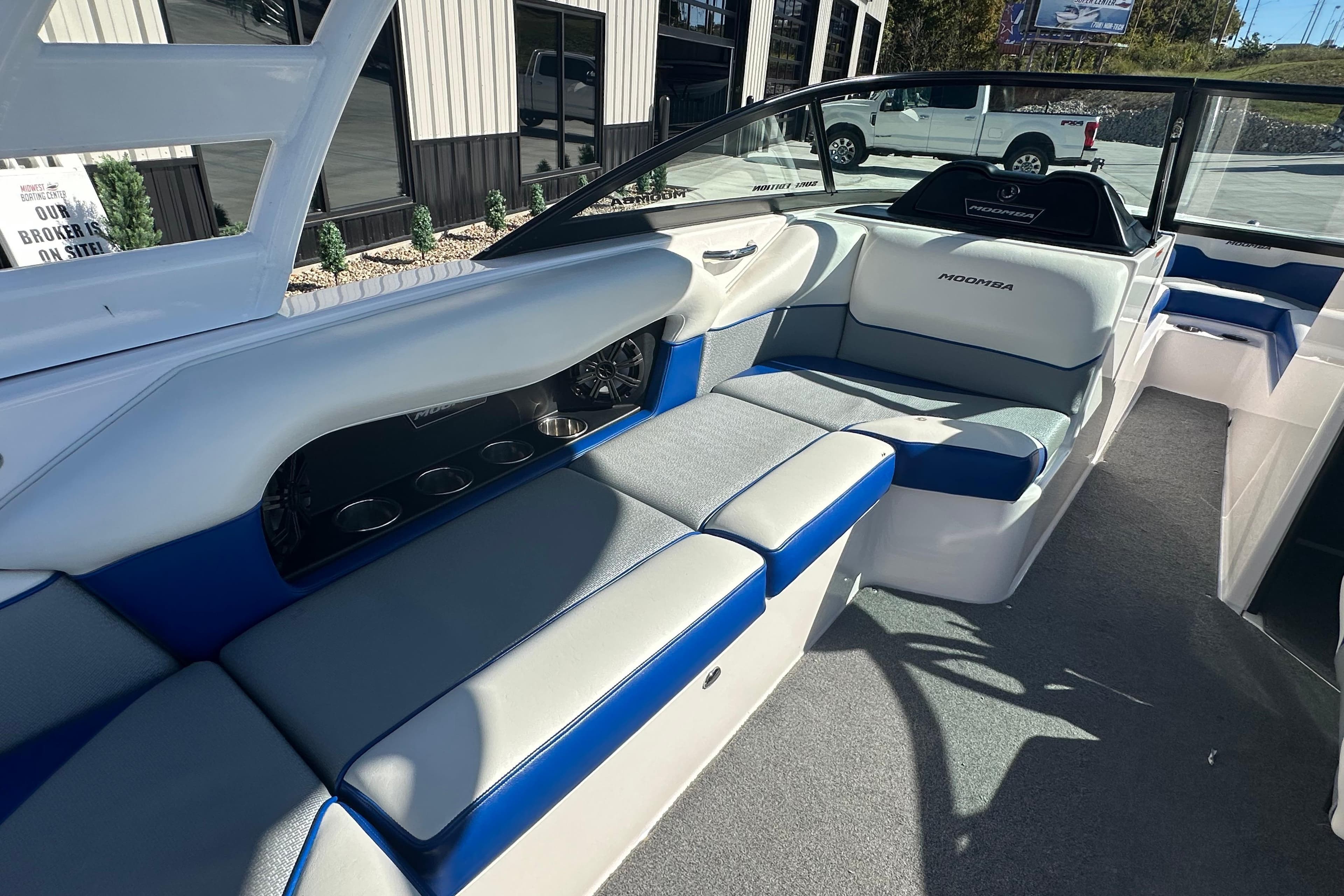 2015 Moomba Mobius LSV boat interior with blue and white seating.