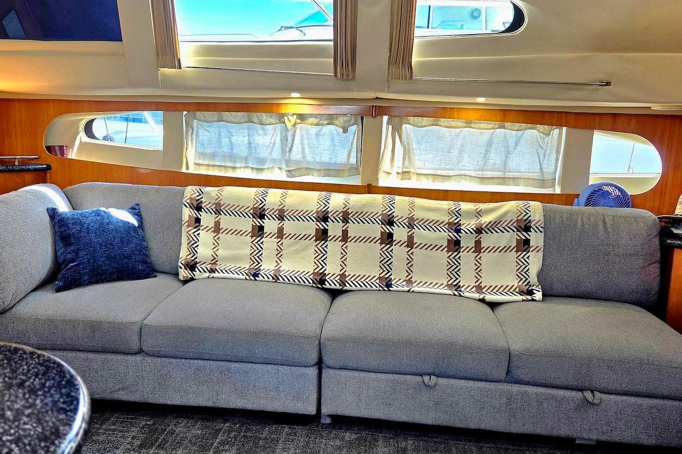 Luxurious interior of 2000 Carver 396 Motor Yacht with cozy sofa and elegant decor.