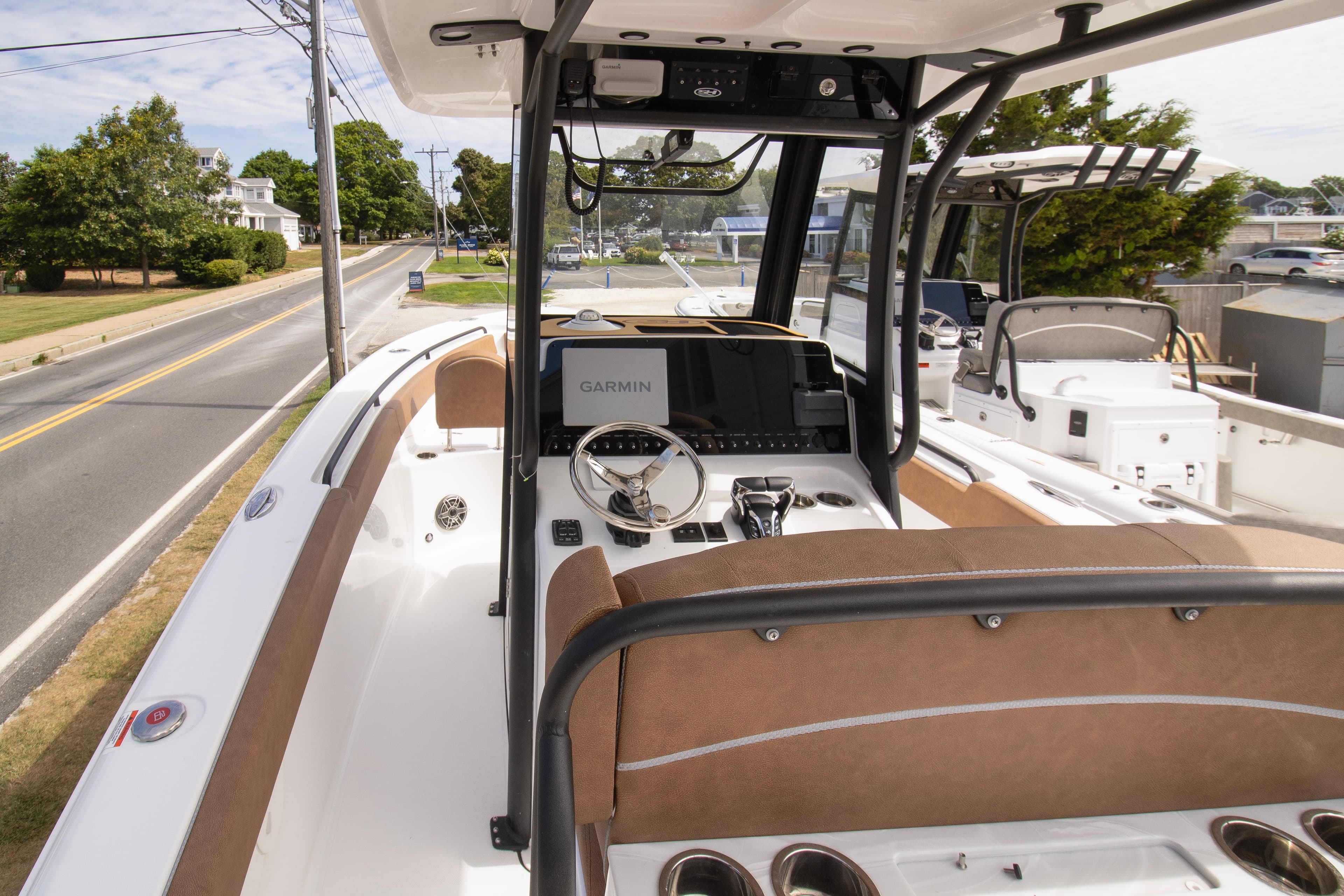 2026 Sea Hunt Ultra 265 SE boat interior with Garmin navigation system and sleek design.