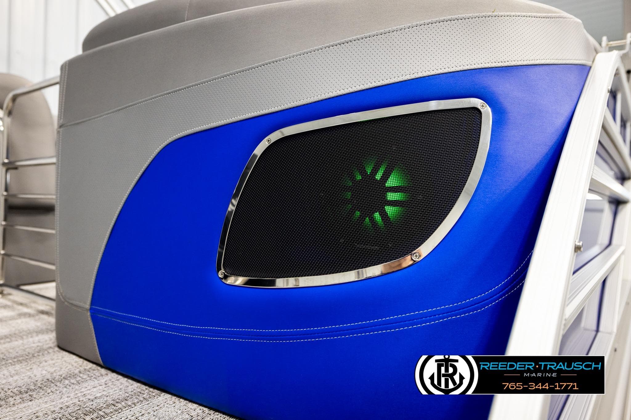 2025 Bennington LTFBSE boat with blue panel and illuminated speaker detail.