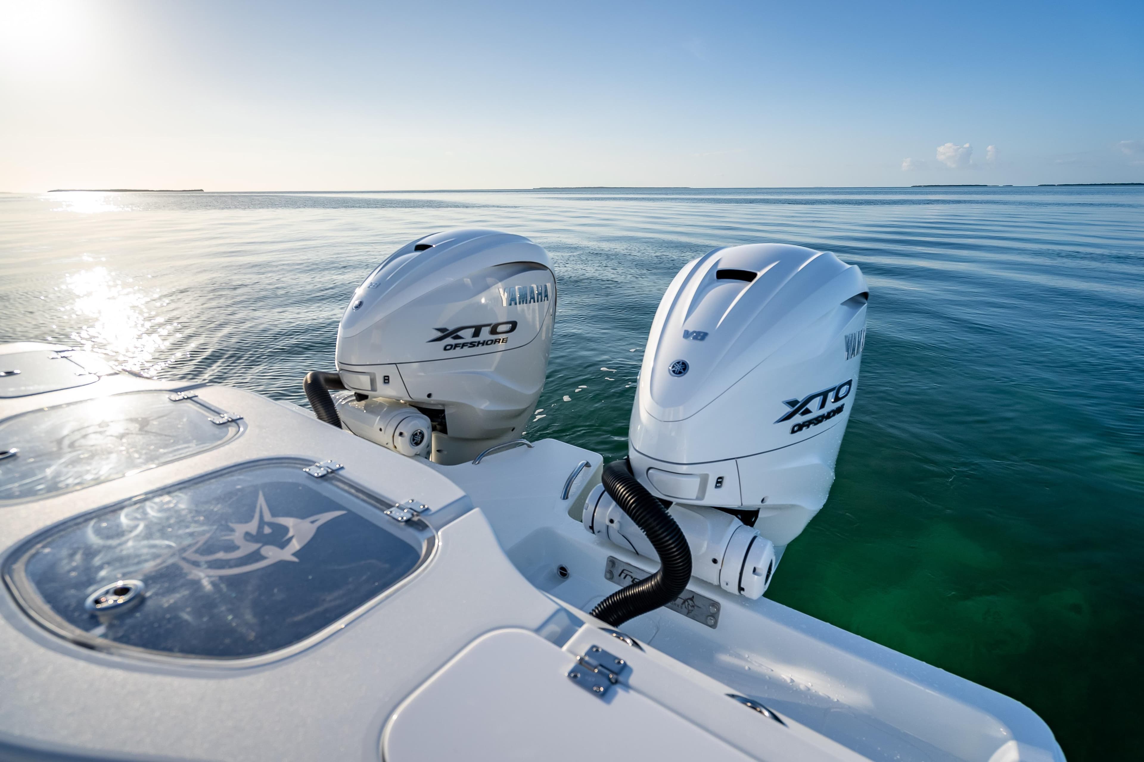 2026 Freeman 35 boat with Yamaha XTO Offshore engines on calm ocean waters.