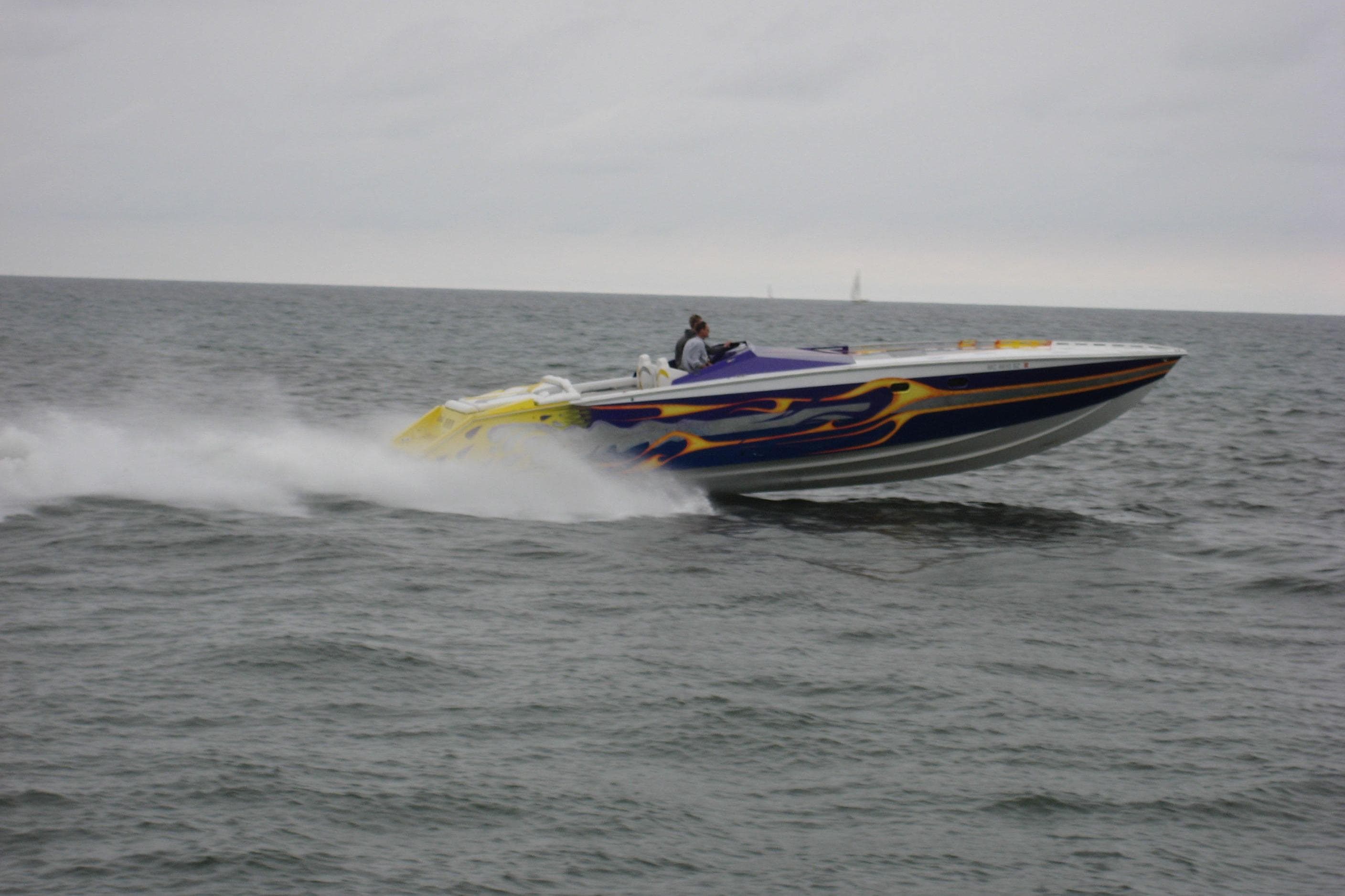 High-speed Python Offshore boat from 2000 racing on open water.