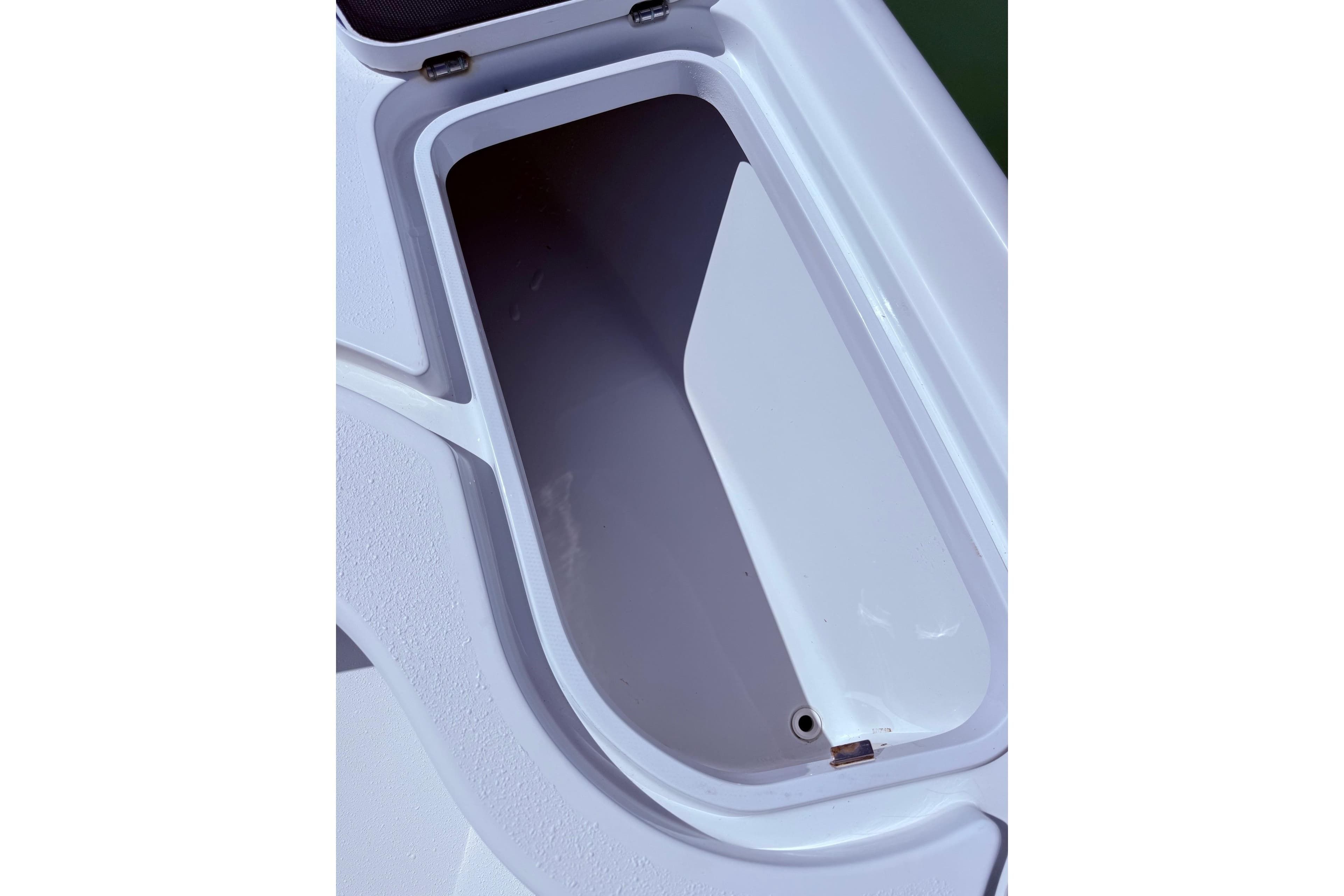 Open storage compartment on a 2014 Yellowfin 24 Bay boat.