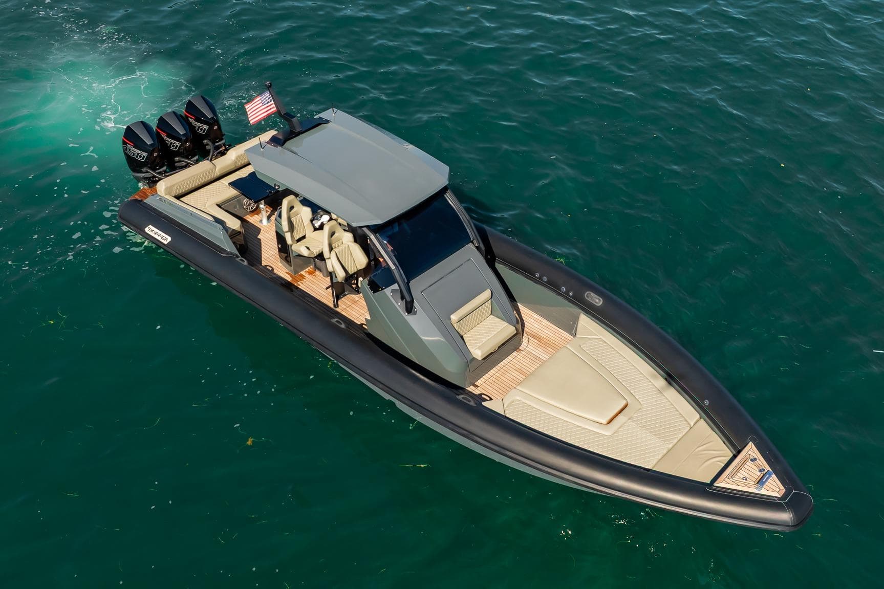 2023 Skipper-BSK 38NC luxury boat on water, featuring sleek design and powerful engines.