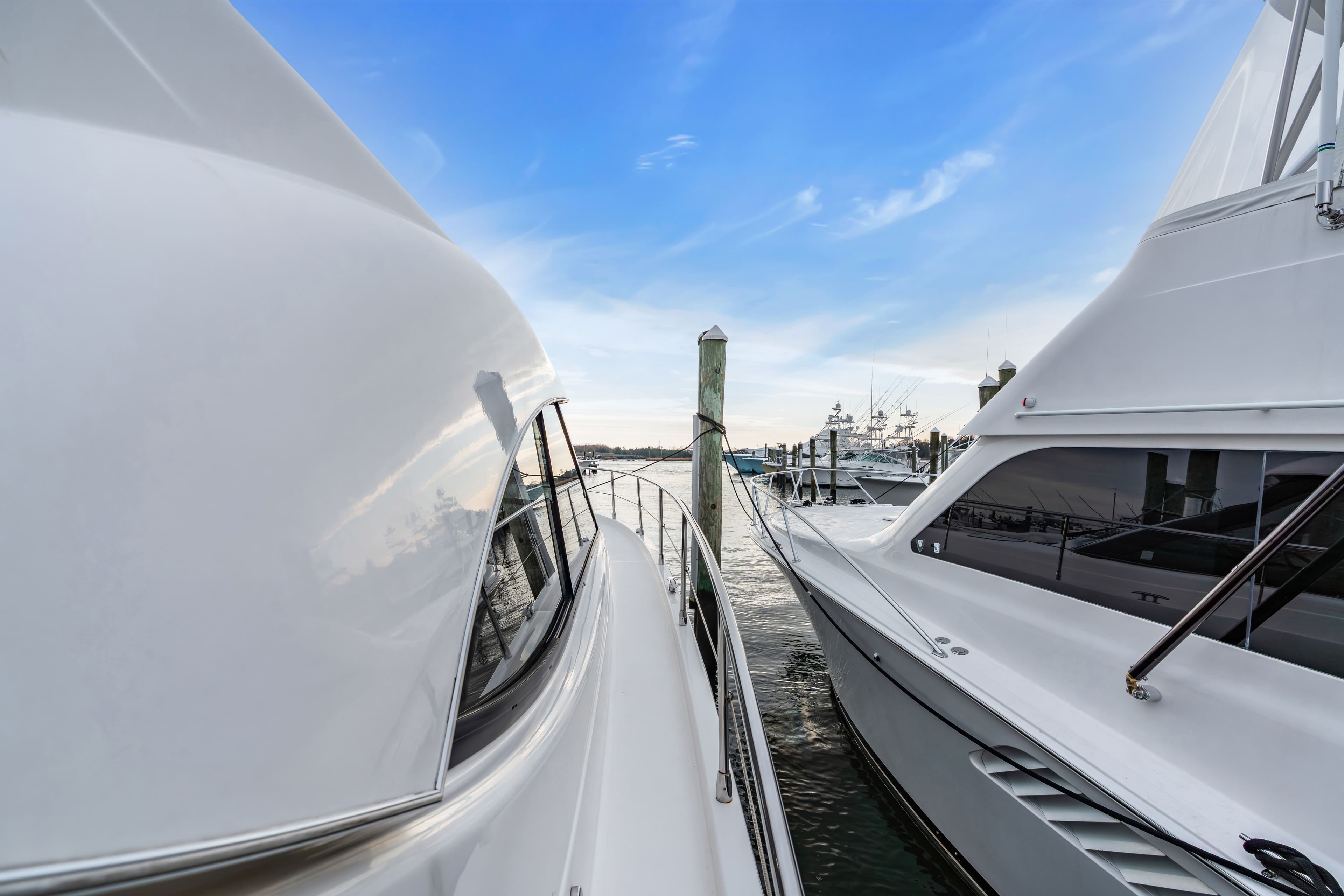 Riviera 44 Sport Yacht 2014 docked, blue sky.