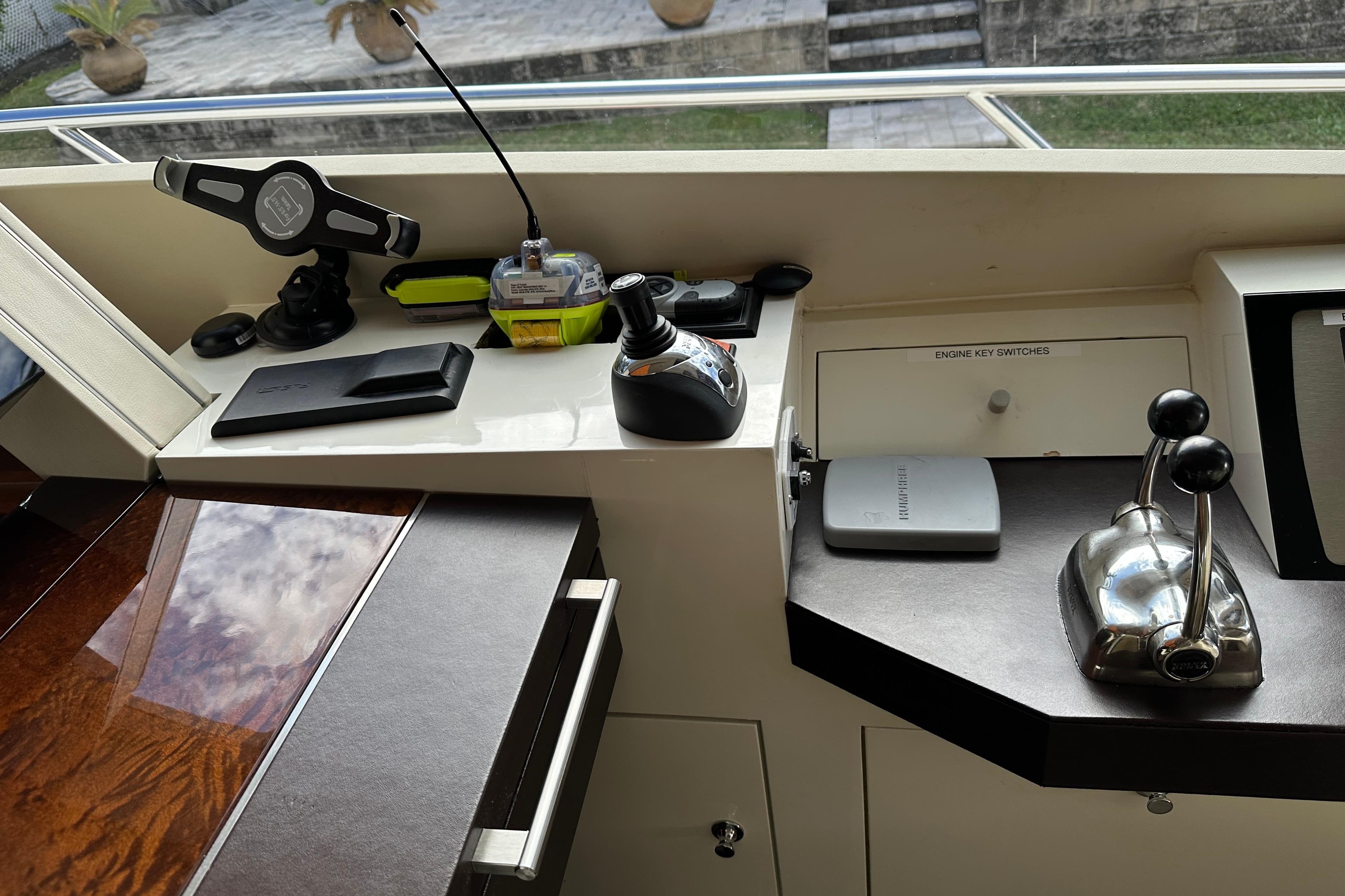 Control panel of 2009 Lazzara LSX 75 yacht with joystick and throttle levers.