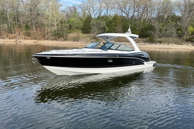 2025 Formula 350 Crossover Bowrider I/O cruising on a calm lake.