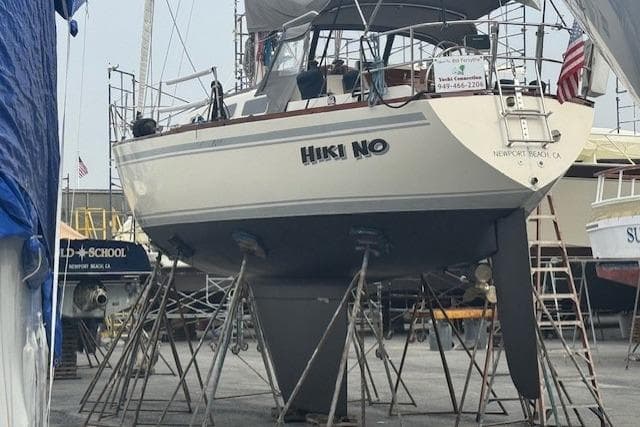 1979 CAL 39 MK II Tall Rig sailboat on stands in a boatyard.