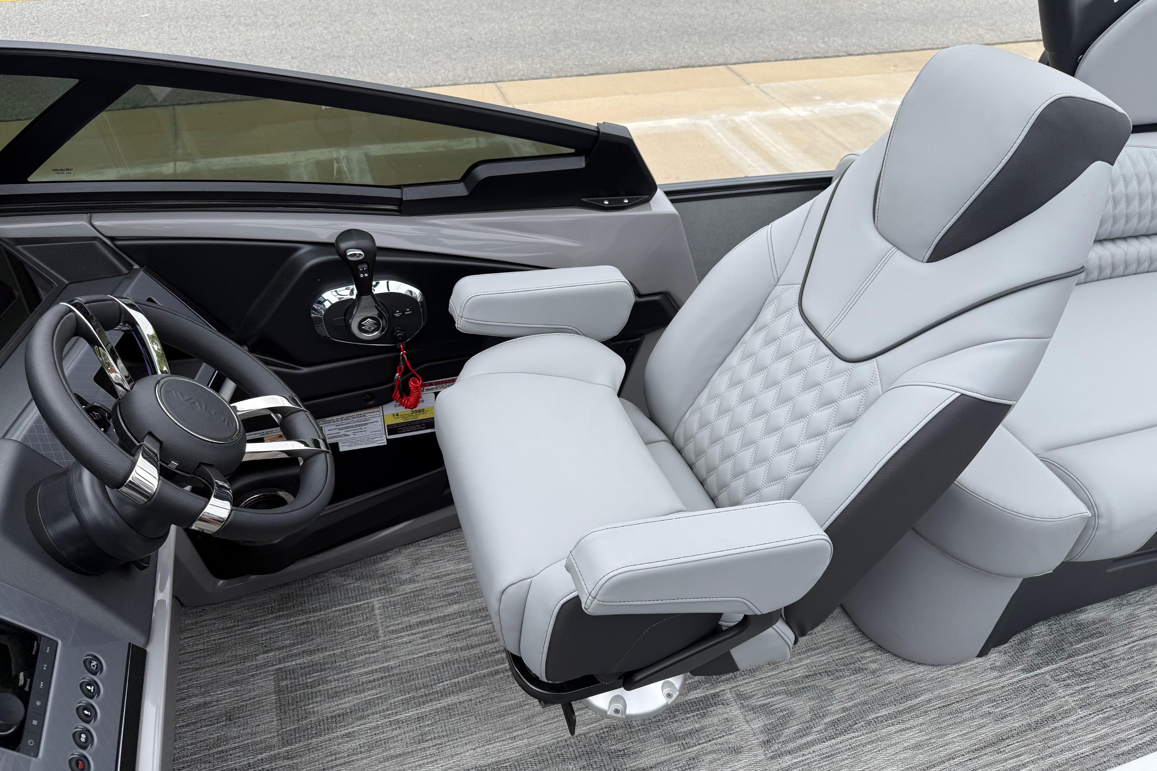 Luxurious interior of 2026 Avalon Excalibur LTD Quad Lounge Windshield boat with plush seating.