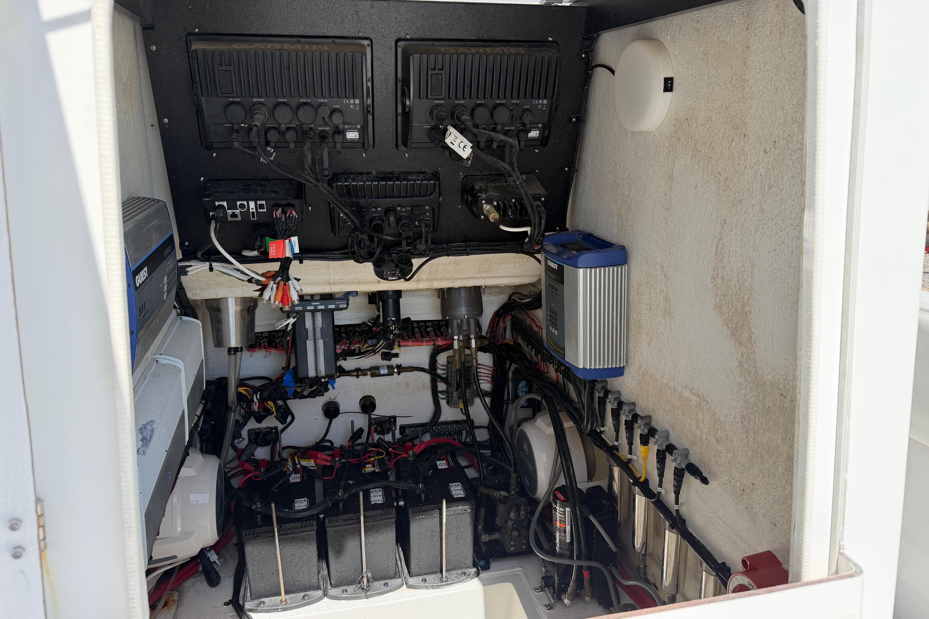 Electrical system setup in a 2021 Competition 31 boat, featuring organized wiring and components.