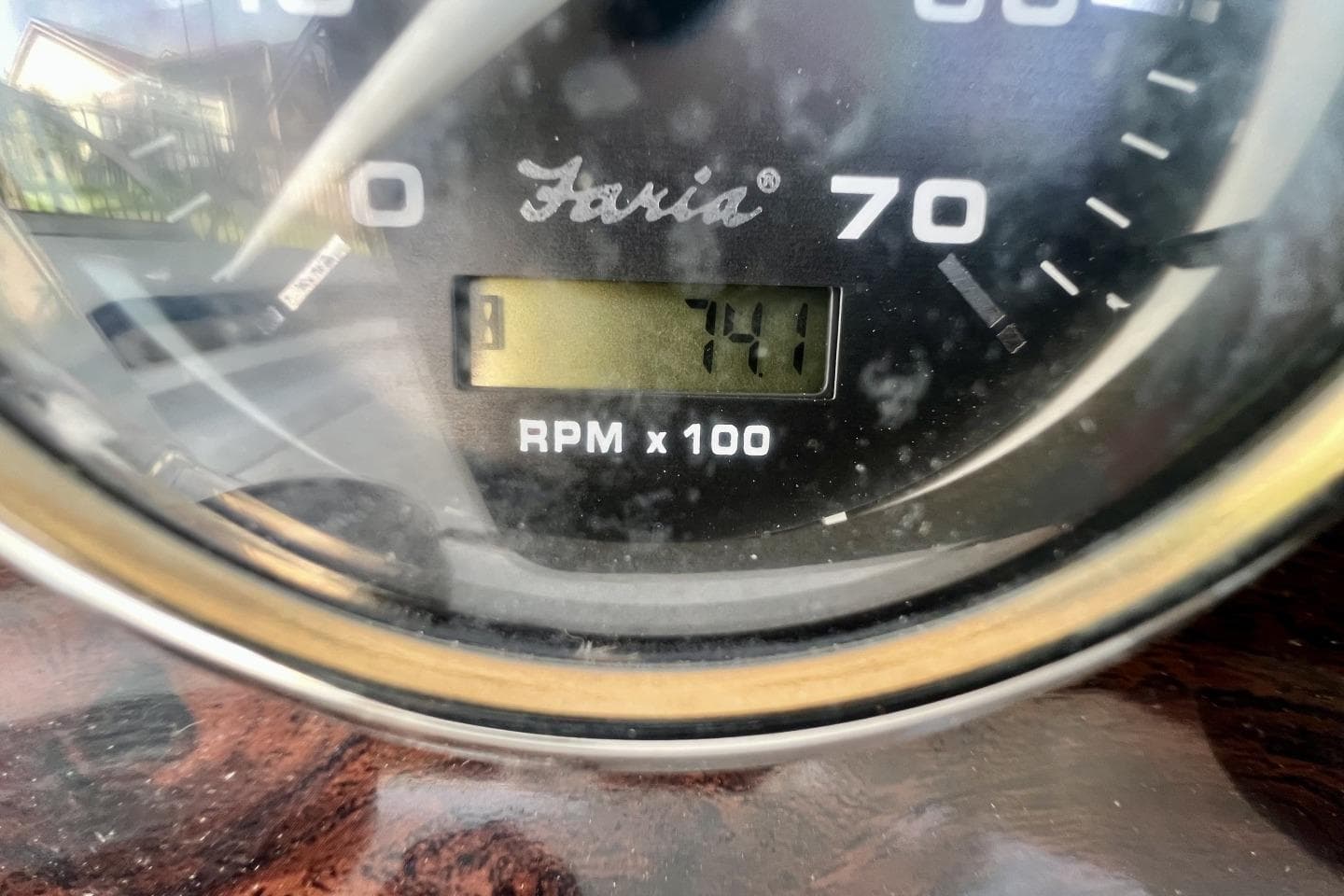 Close-up of a 2013 Hurricane SunDeck 187 OB tachometer displaying 741 RPM.