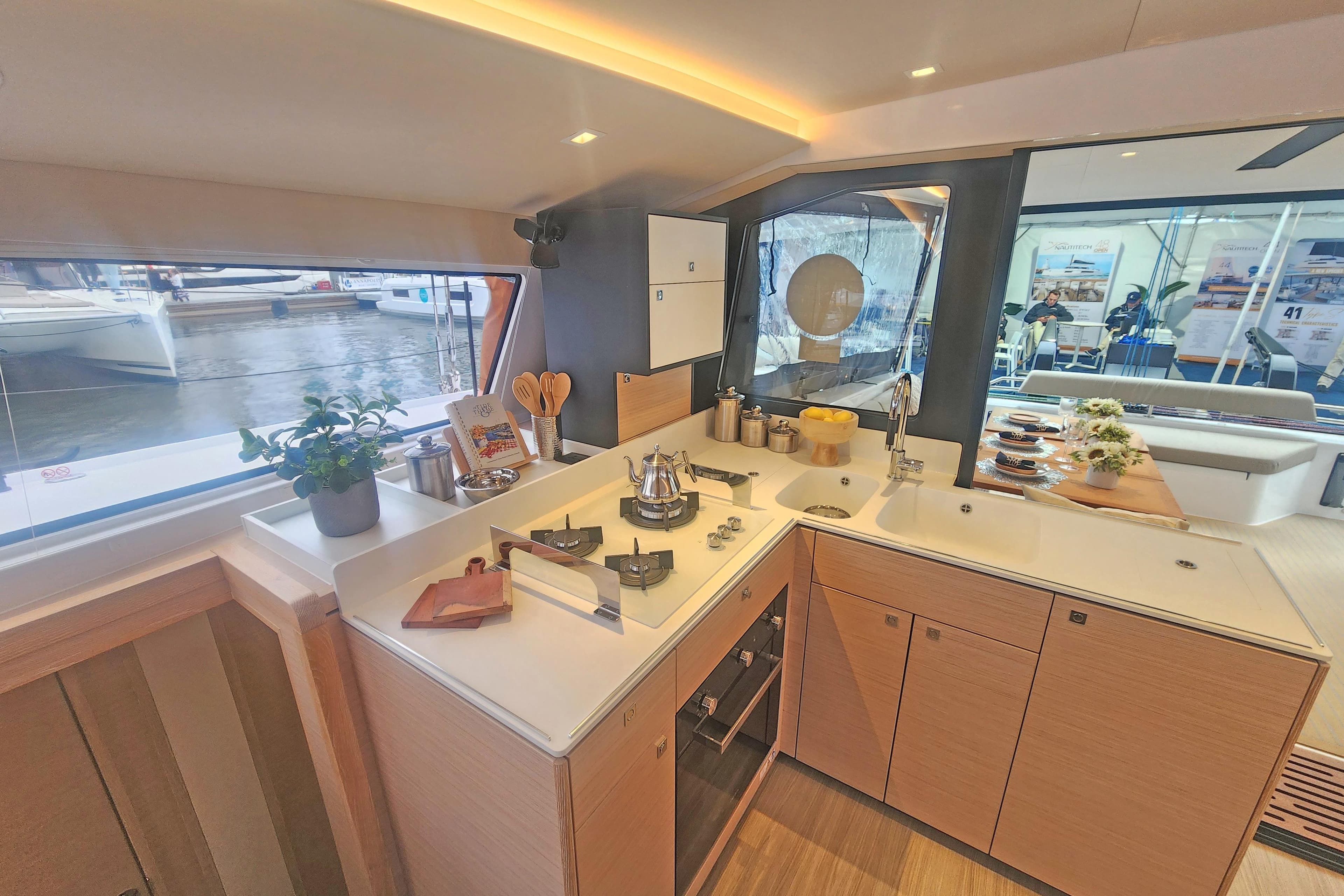 Modern kitchen interior of 2025 Nautitech 44 Open yacht, featuring sleek design and ample natural light.