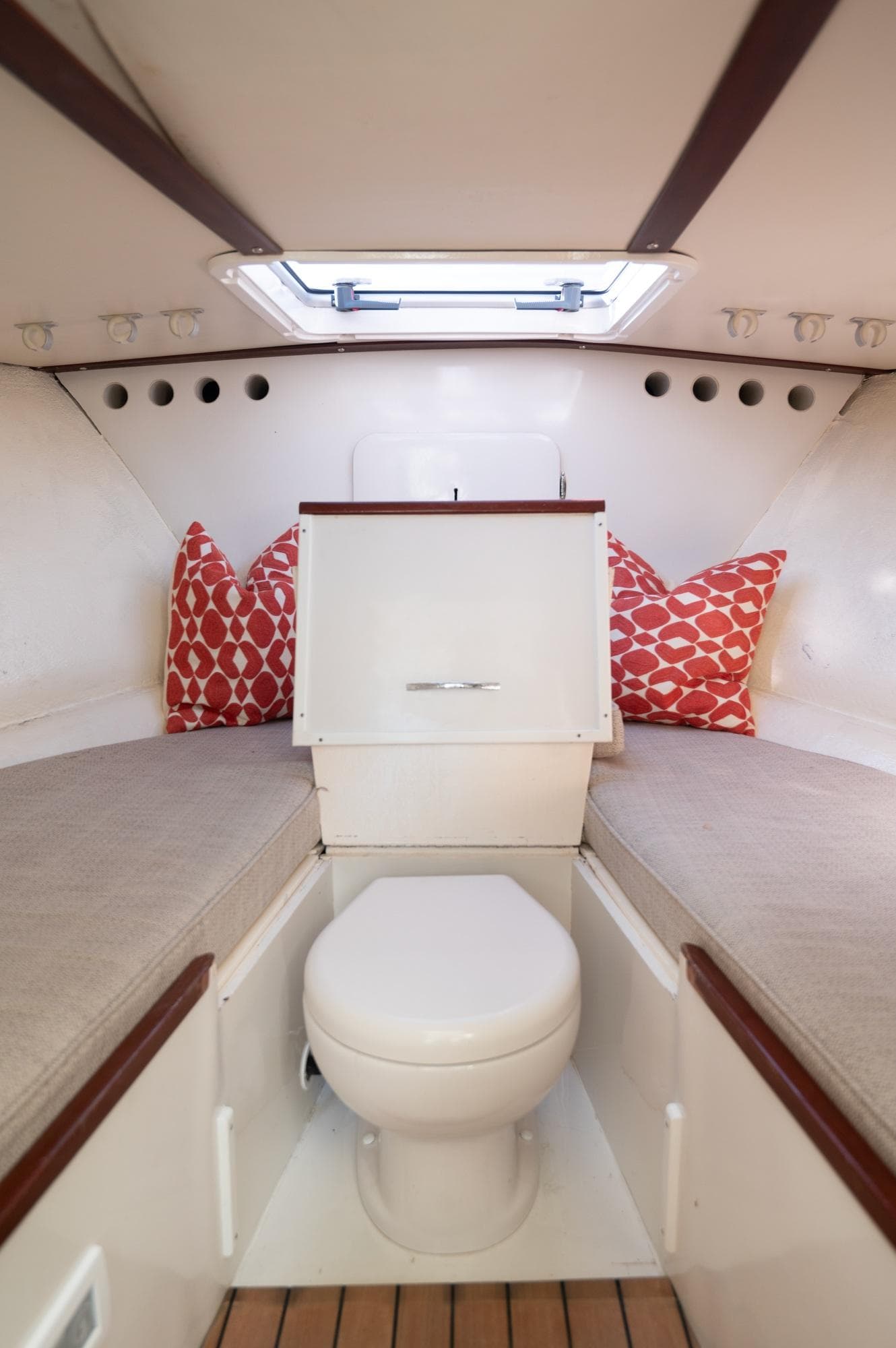 Interior of 1969 Bertram 31 Classic boat with cozy seating and nautical decor.