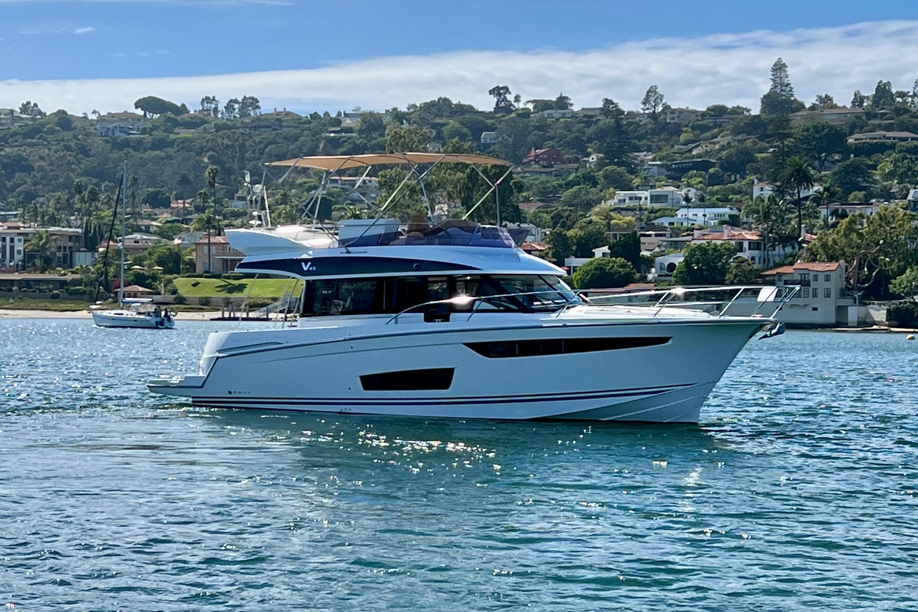2017 Jeanneau Velasco 43 yacht cruising on scenic coastal waters.