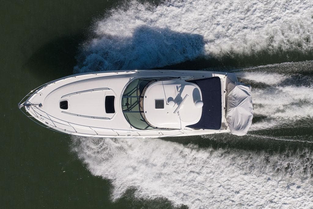 Aerial view of 2005 Sea Ray 420 Sundancer cruising on water.