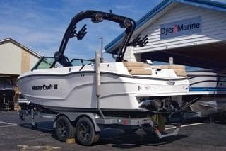 2025 MasterCraft XT20 boat on trailer at Dyer Marine dealership.