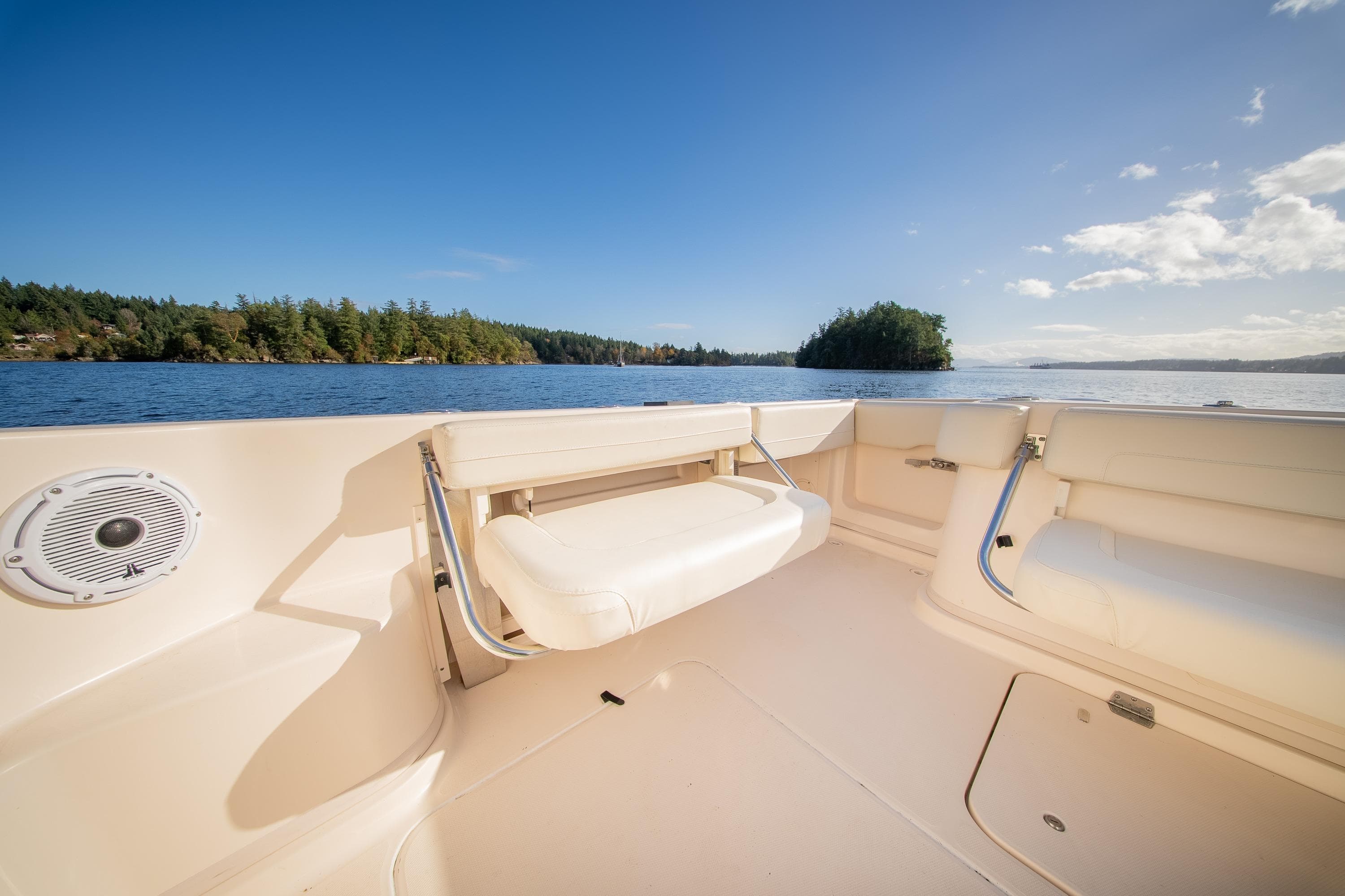2015 Grady-White Express 370 boat interior with scenic lake view and clear blue sky.