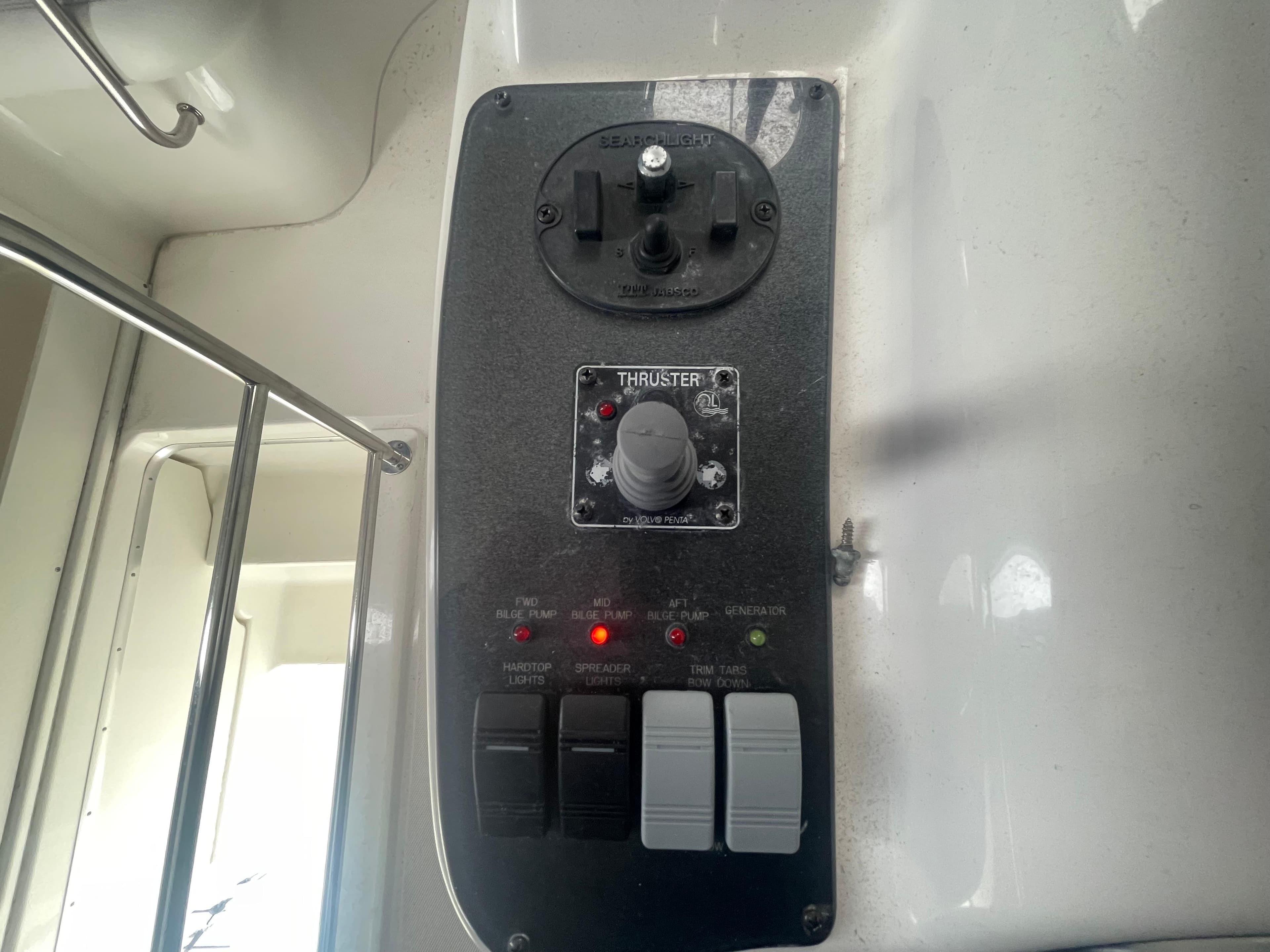 Control panel of a 2006 Silverton 42 Convertible boat, featuring thruster controls.