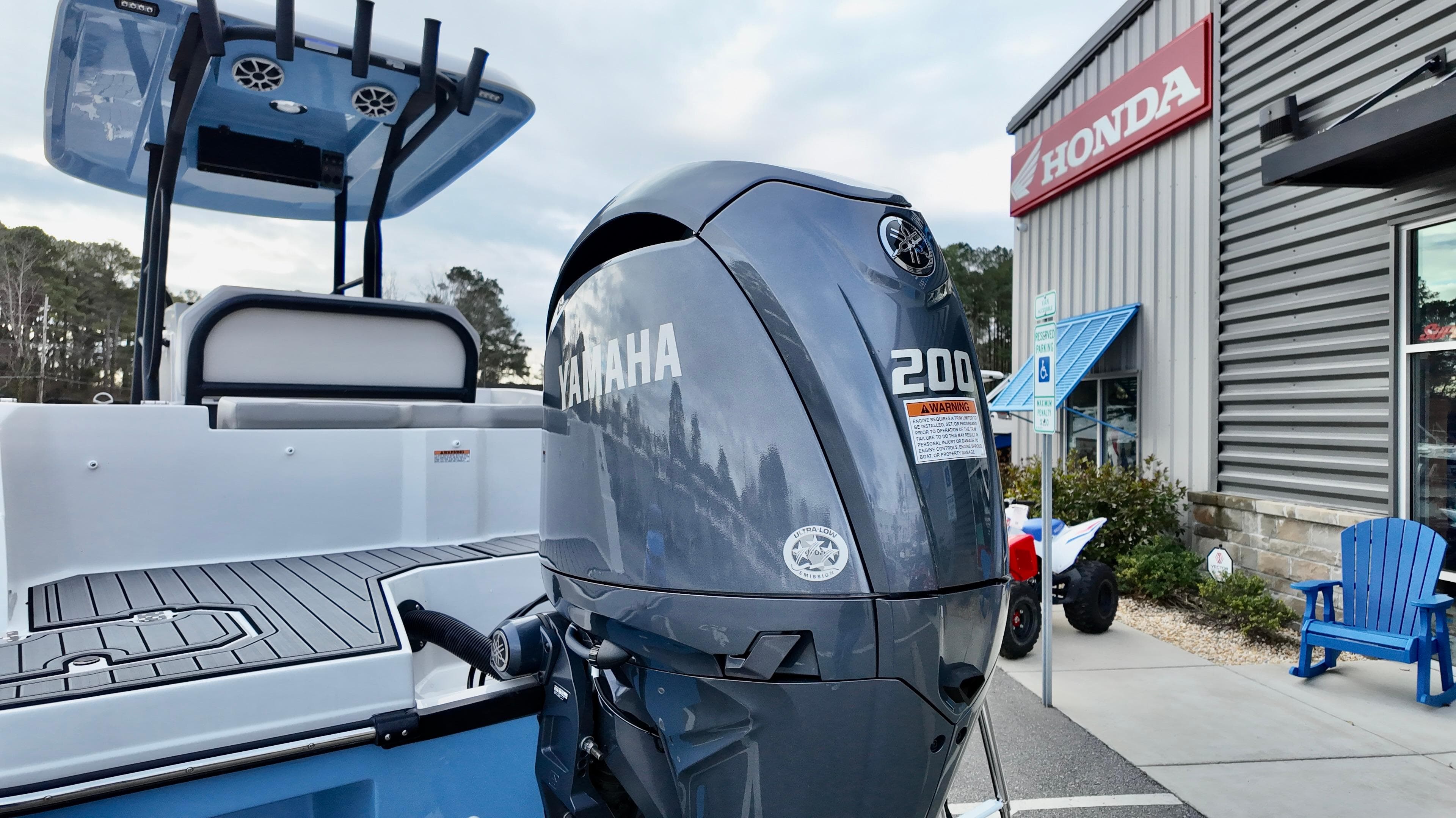 2025 Starcraft SVX 231 OB CC boat with Yamaha 200 engine at dealership.