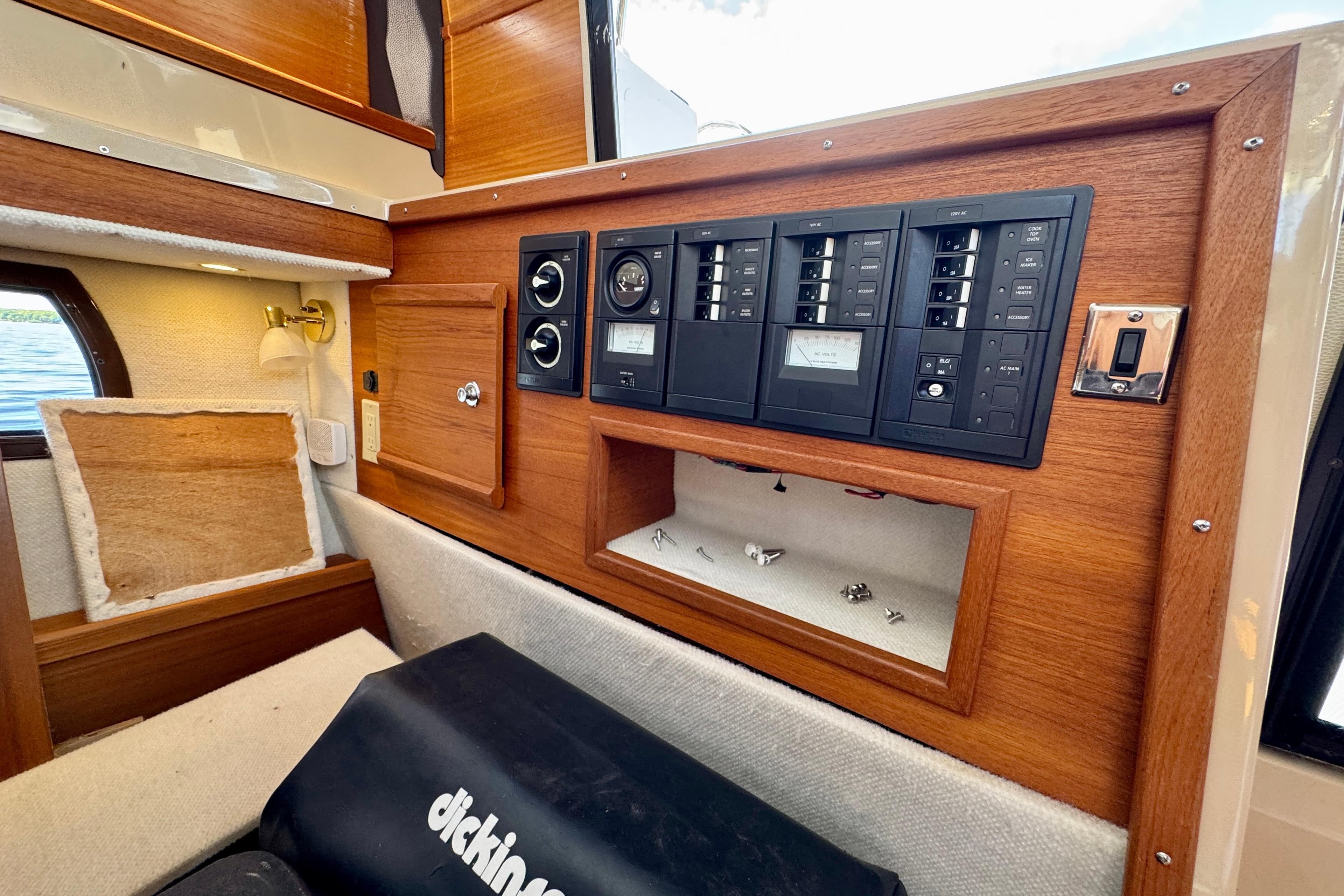 Interior view of a 2017 Ranger Tugs R-29 CB, featuring a wooden control panel.