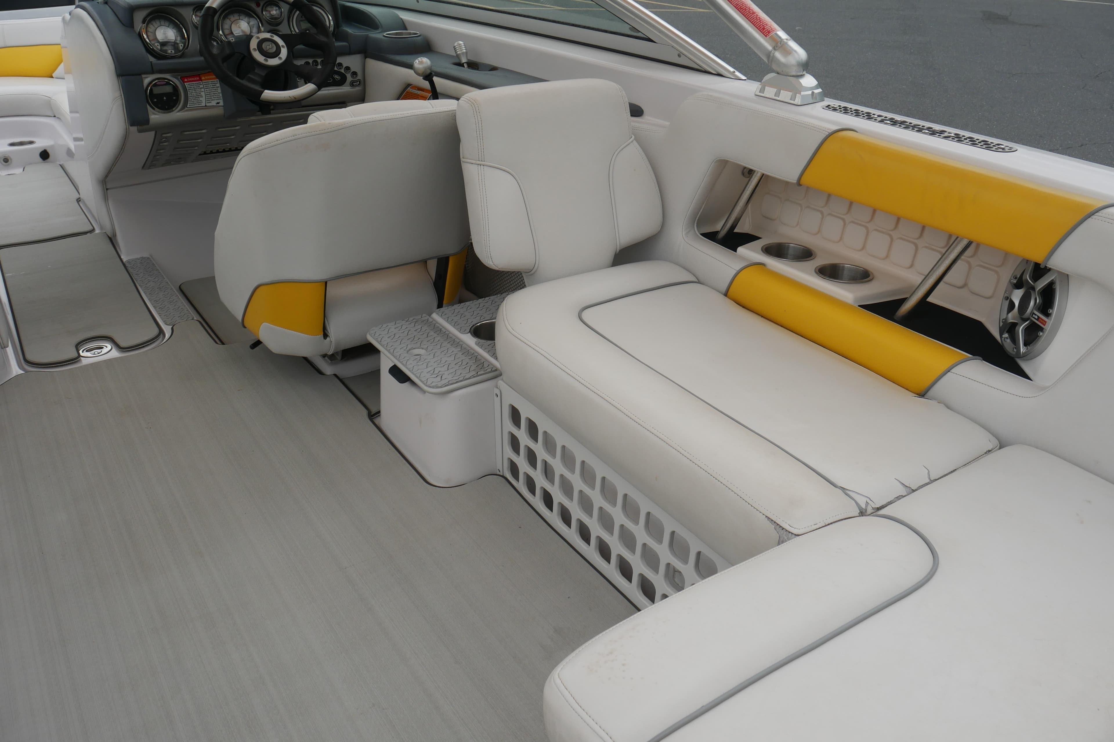 2007 Correct Craft 236 Team Edition boat interior with white and yellow seating.