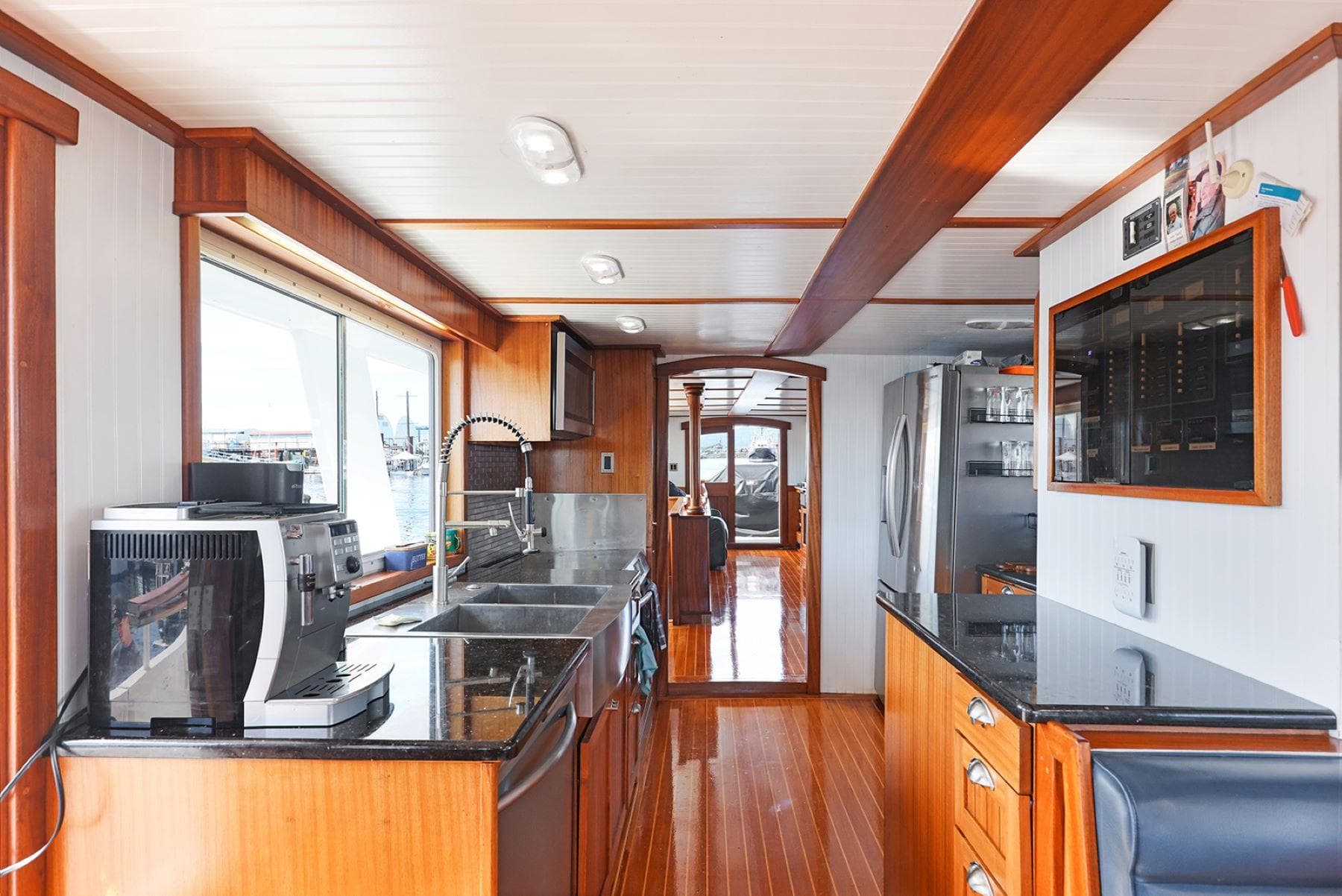 Interior of a 1935 Vintage Fenner & Hood Heritage Cruiser with modern kitchen amenities.
