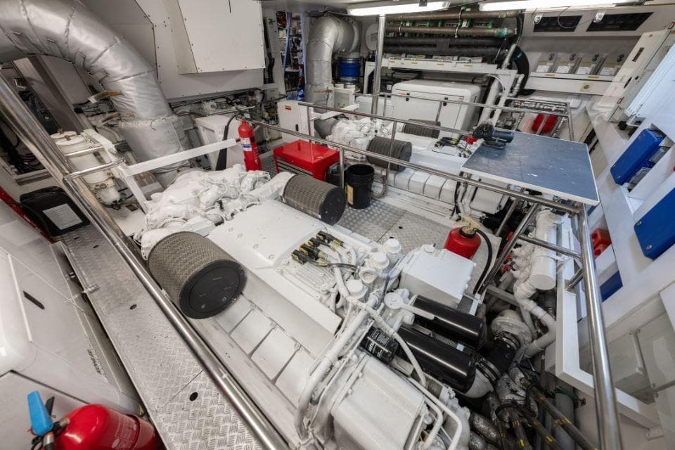 Engine room of 2009 Sunseeker 34 Metre Yacht, featuring machinery and fire safety equipment.