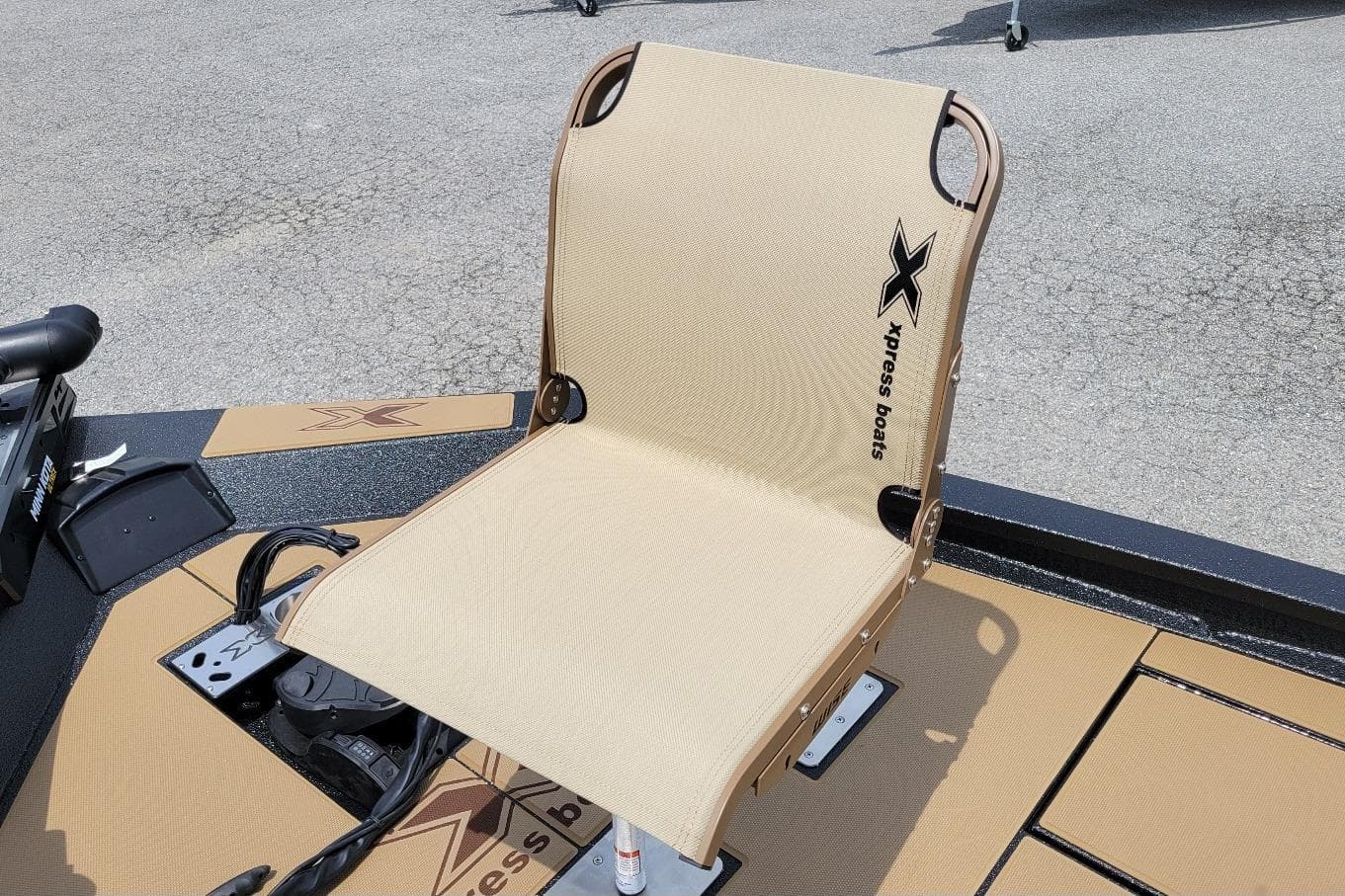 2026 Xpress H20C Crappie boat seat with logo, beige color, on deck.