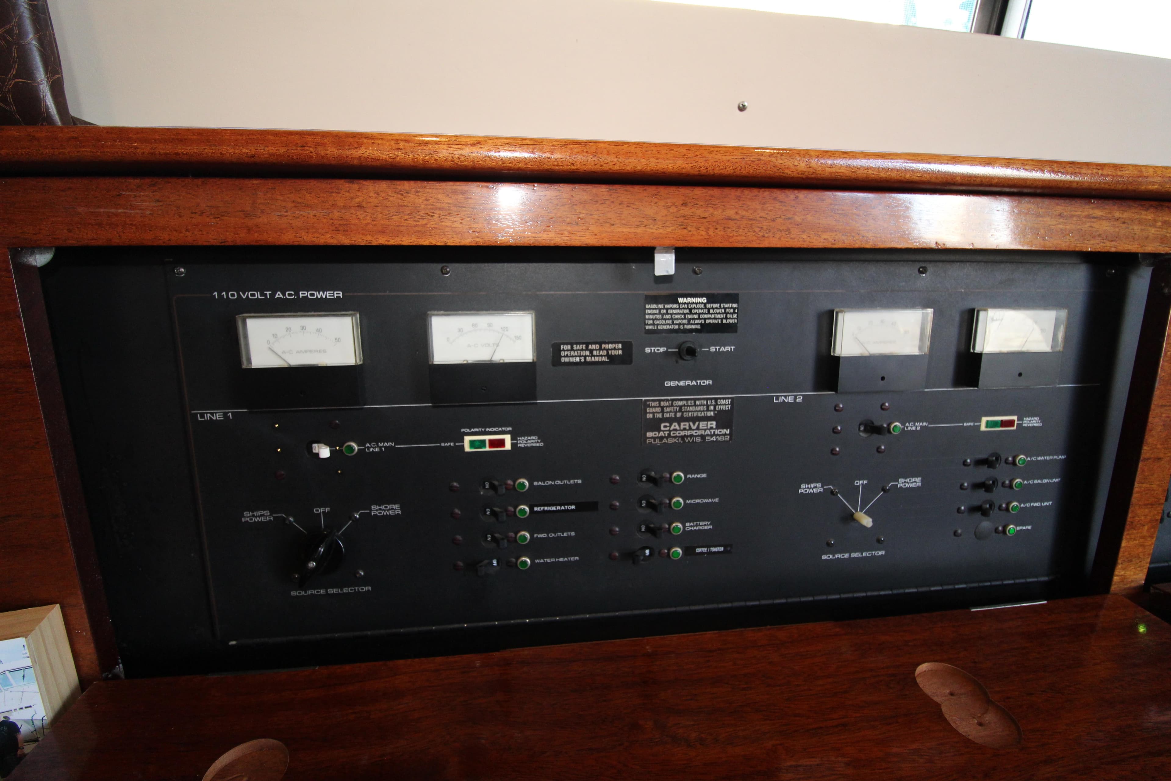 Electrical control panel of a 1990 Carver 3467 Santego boat, featuring gauges and switches.