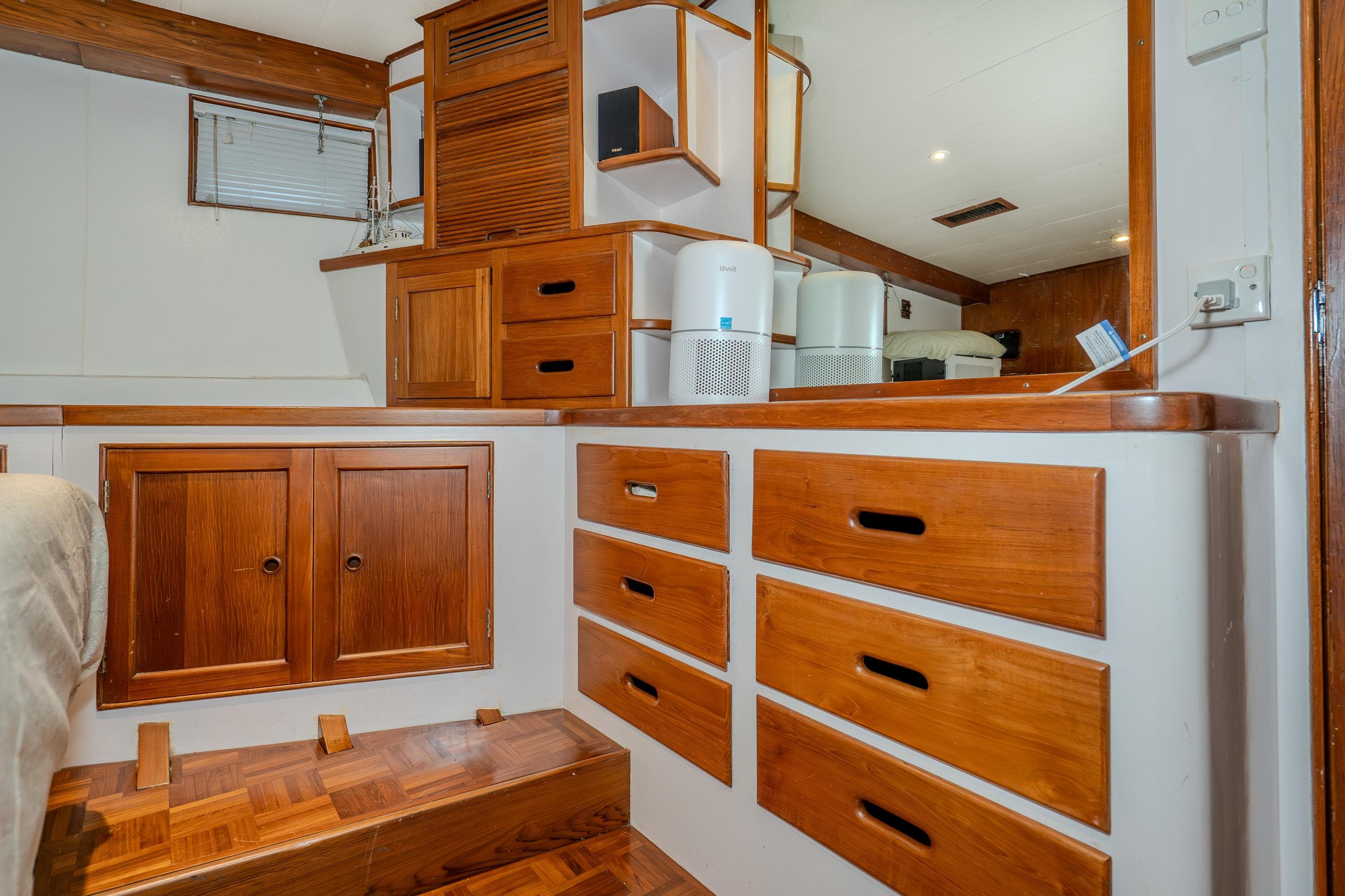 Interior of 1973 American Marine Alaskan 53 yacht with wooden cabinetry and modern appliances.