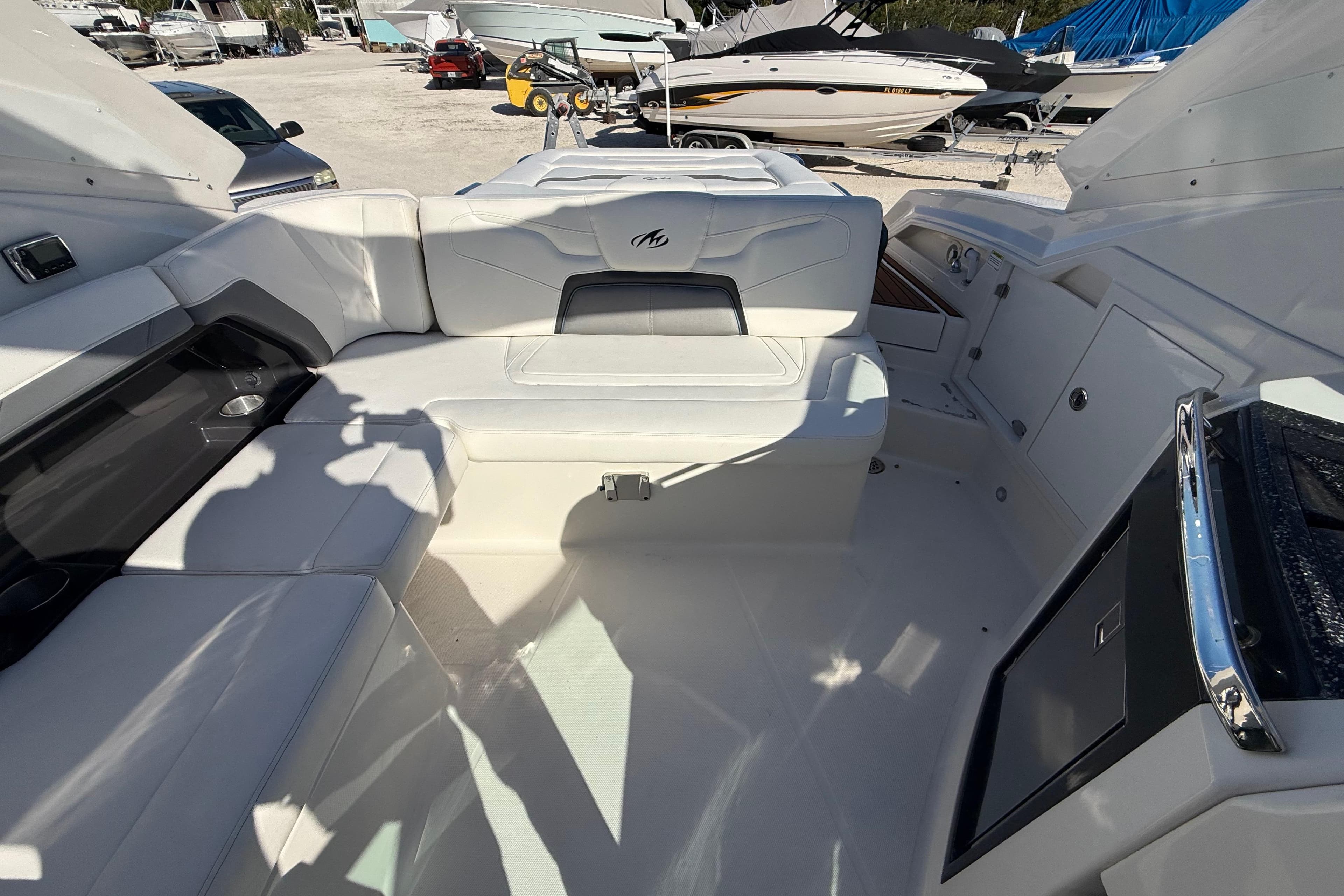 Interior of a 2014 Monterey 328SS Super Sport boat with white seating and modern design.