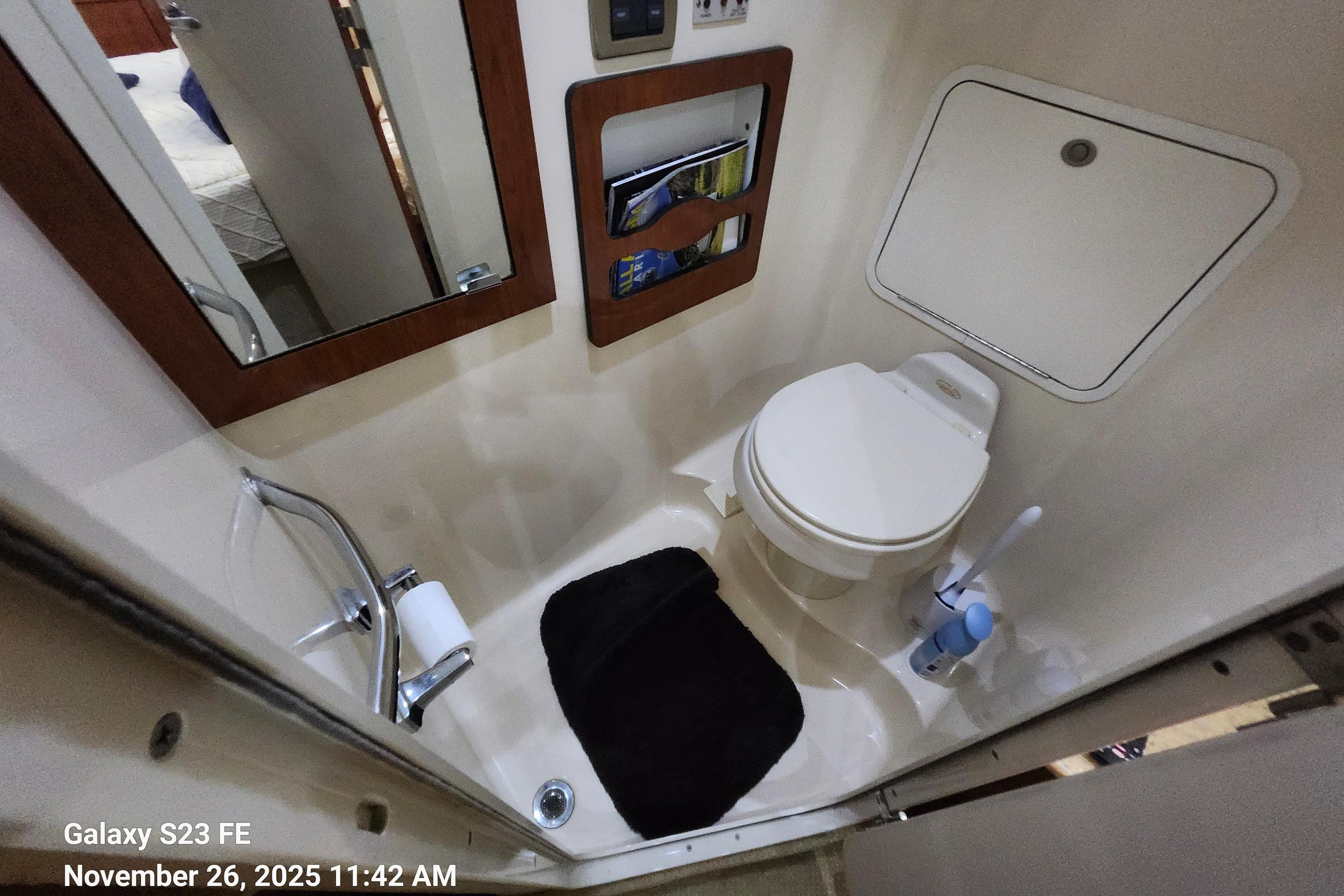 Bathroom interior of 2004 Sea Ray 390 Motor Yacht with toilet and mirror.