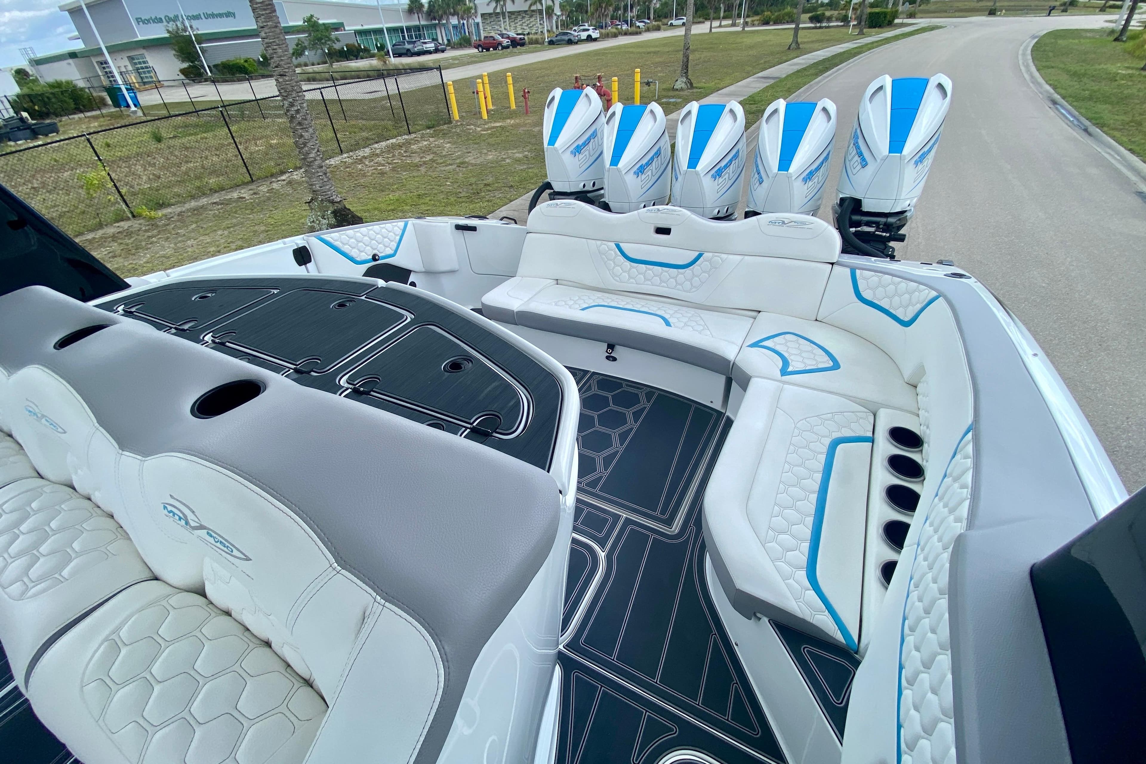 Luxurious 2024 MTI V50 boat interior with plush seating and modern design elements.