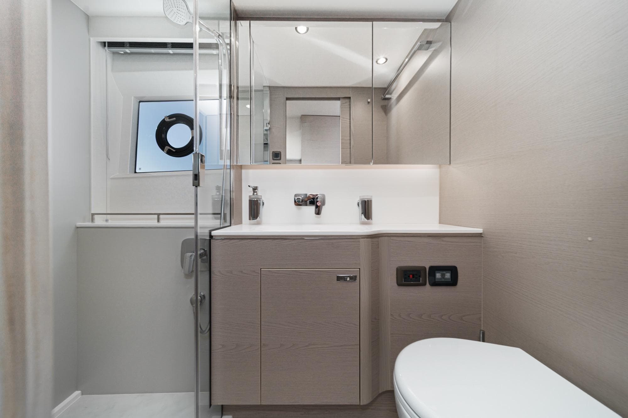 Modern bathroom interior on 2026 Princess V55 yacht, featuring sleek design and elegant fixtures.