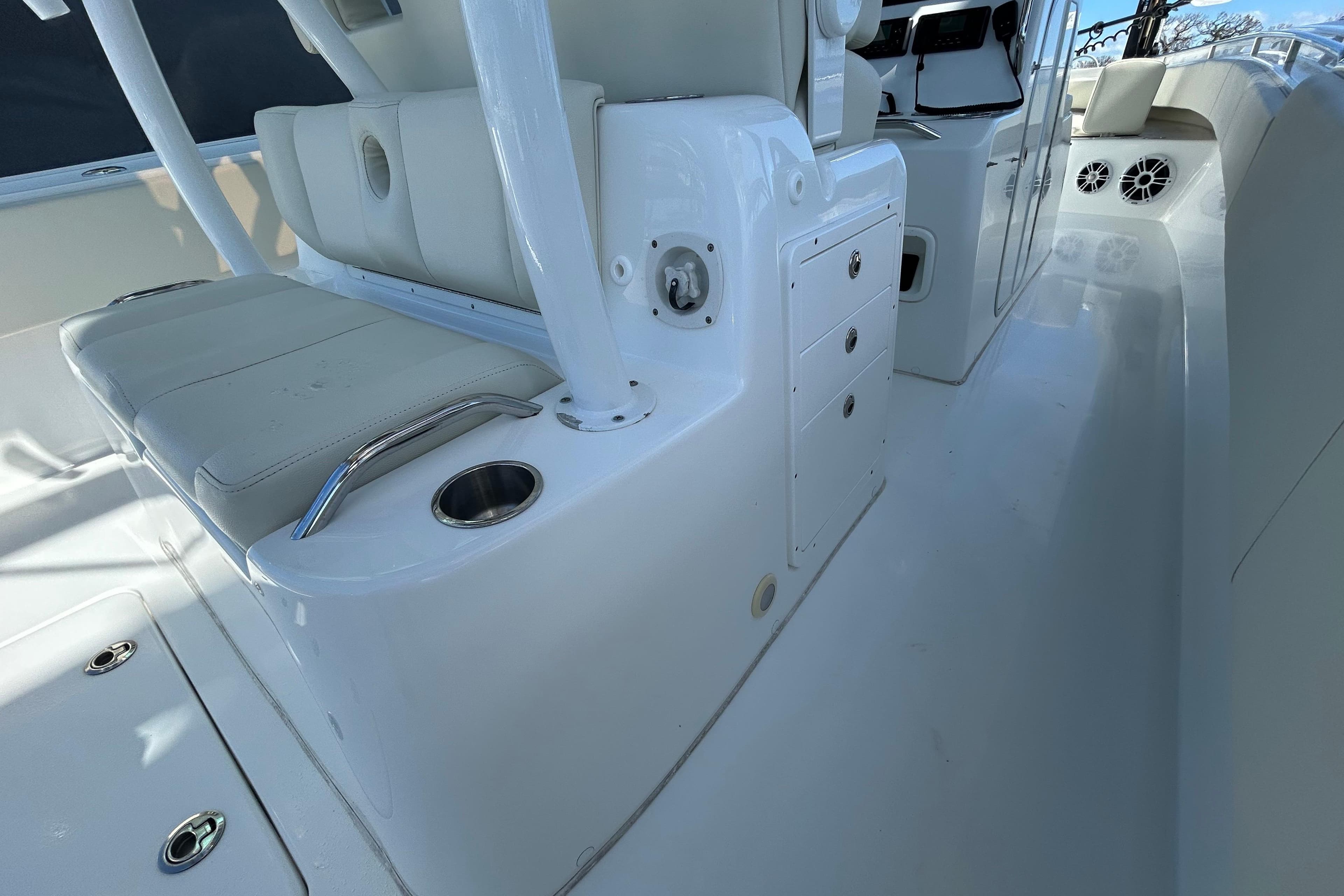2022 Cape Horn 36 boat interior with white seating and storage compartments.
