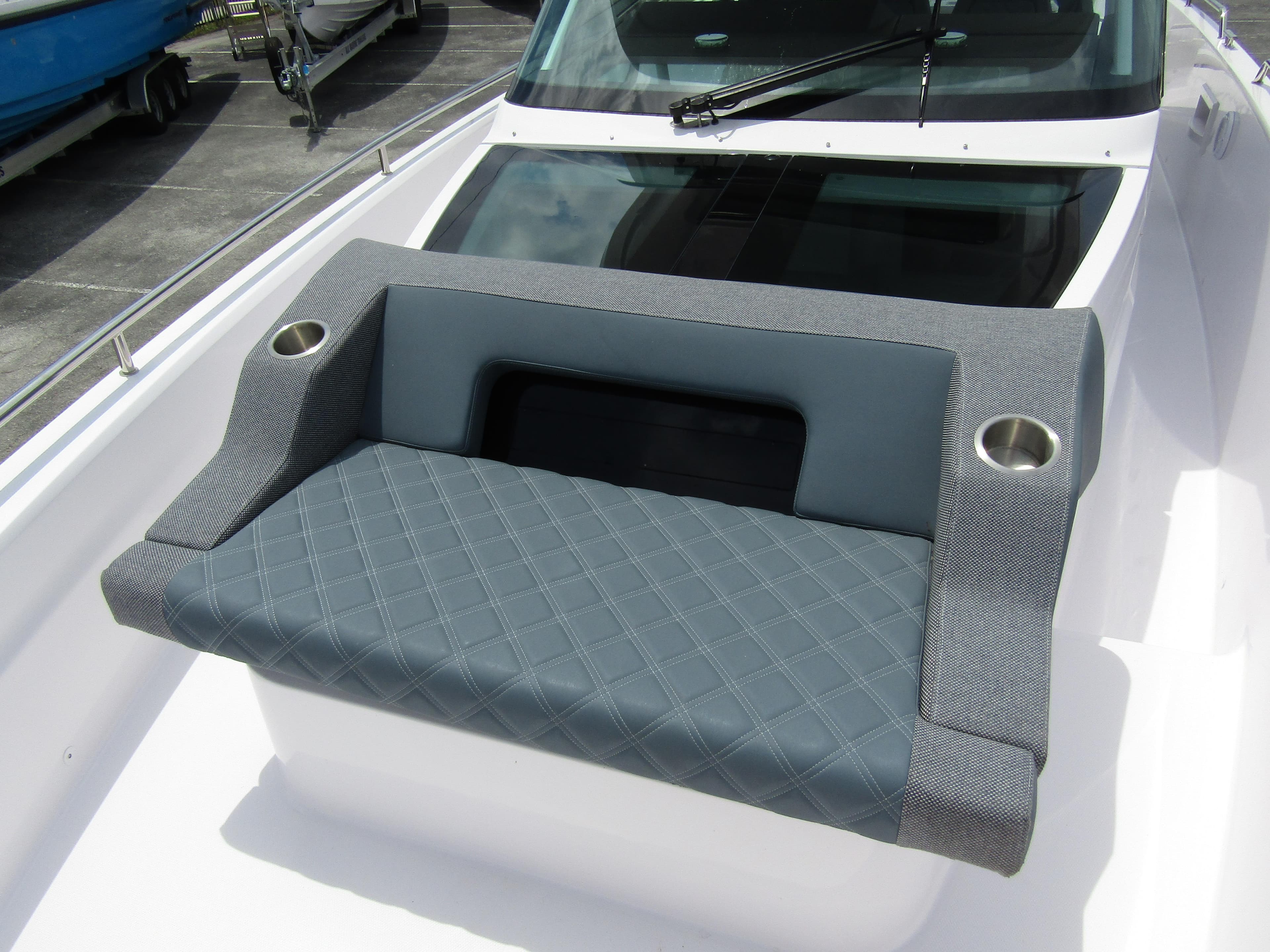 2024 Axopar 37 Sun Top boat seating with cup holders and quilted design.