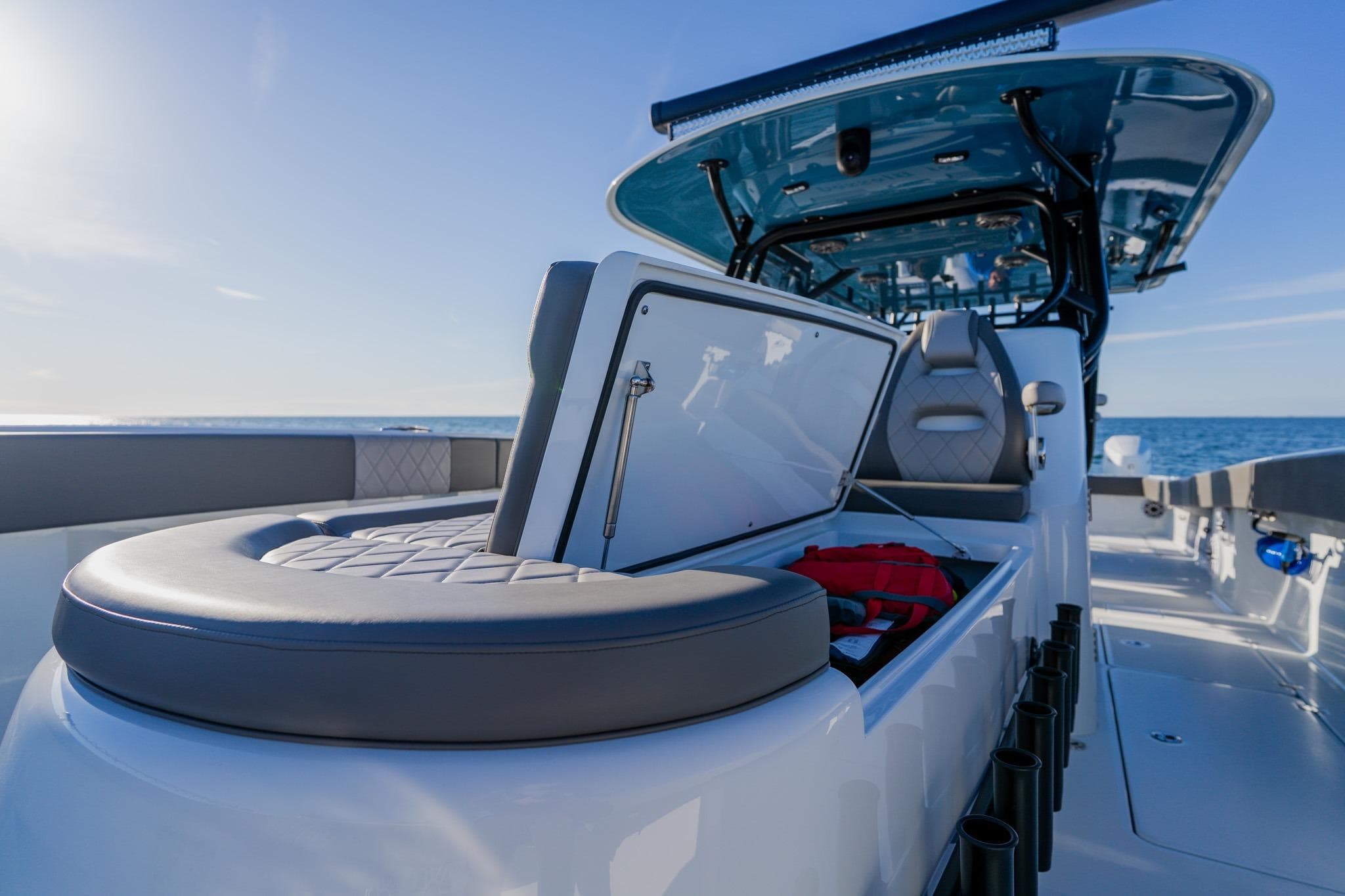 2025 Freeman 42LR boat interior with open storage compartment, ocean view.