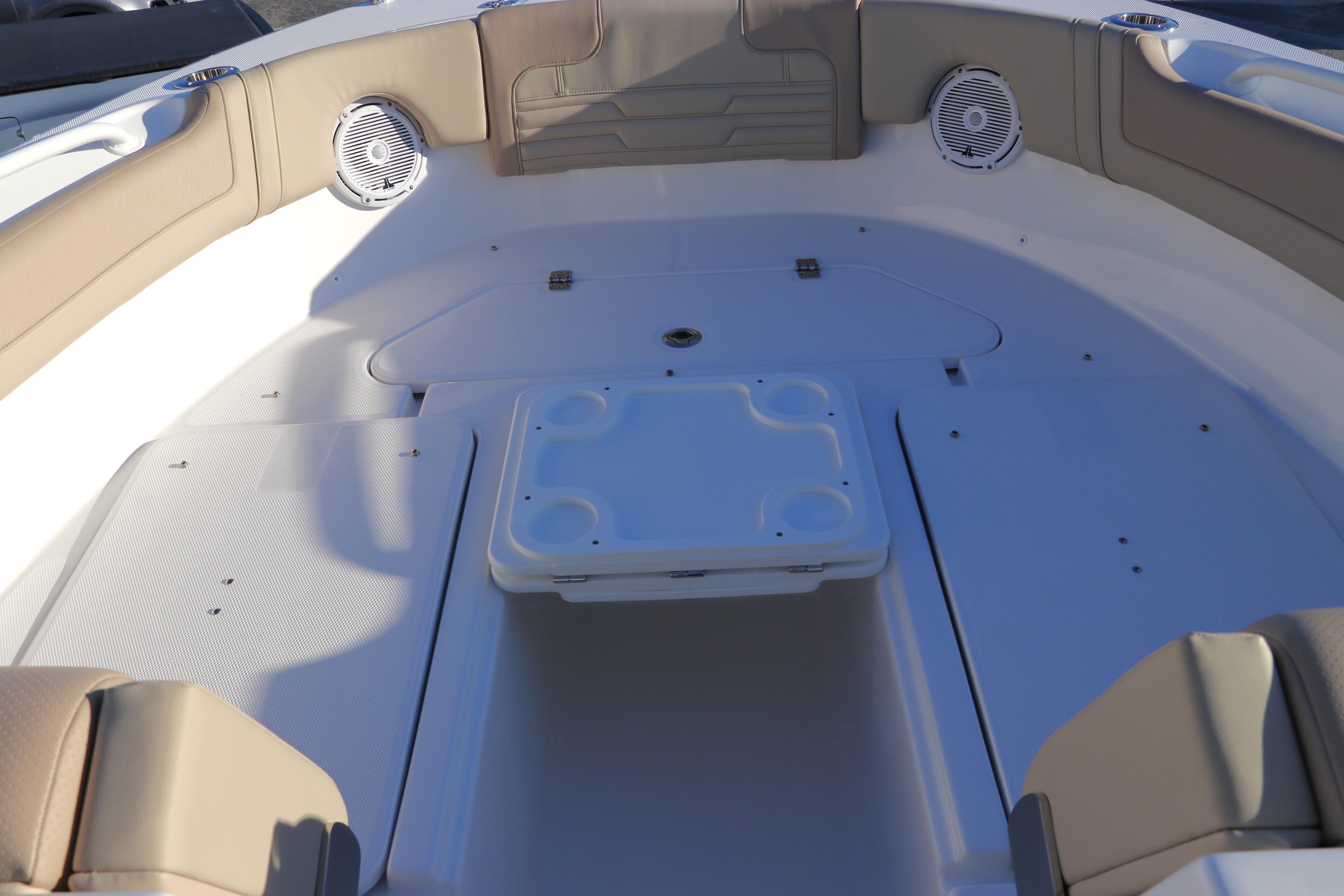2025 Edgewater 248 CX boat interior with seating and speakers.