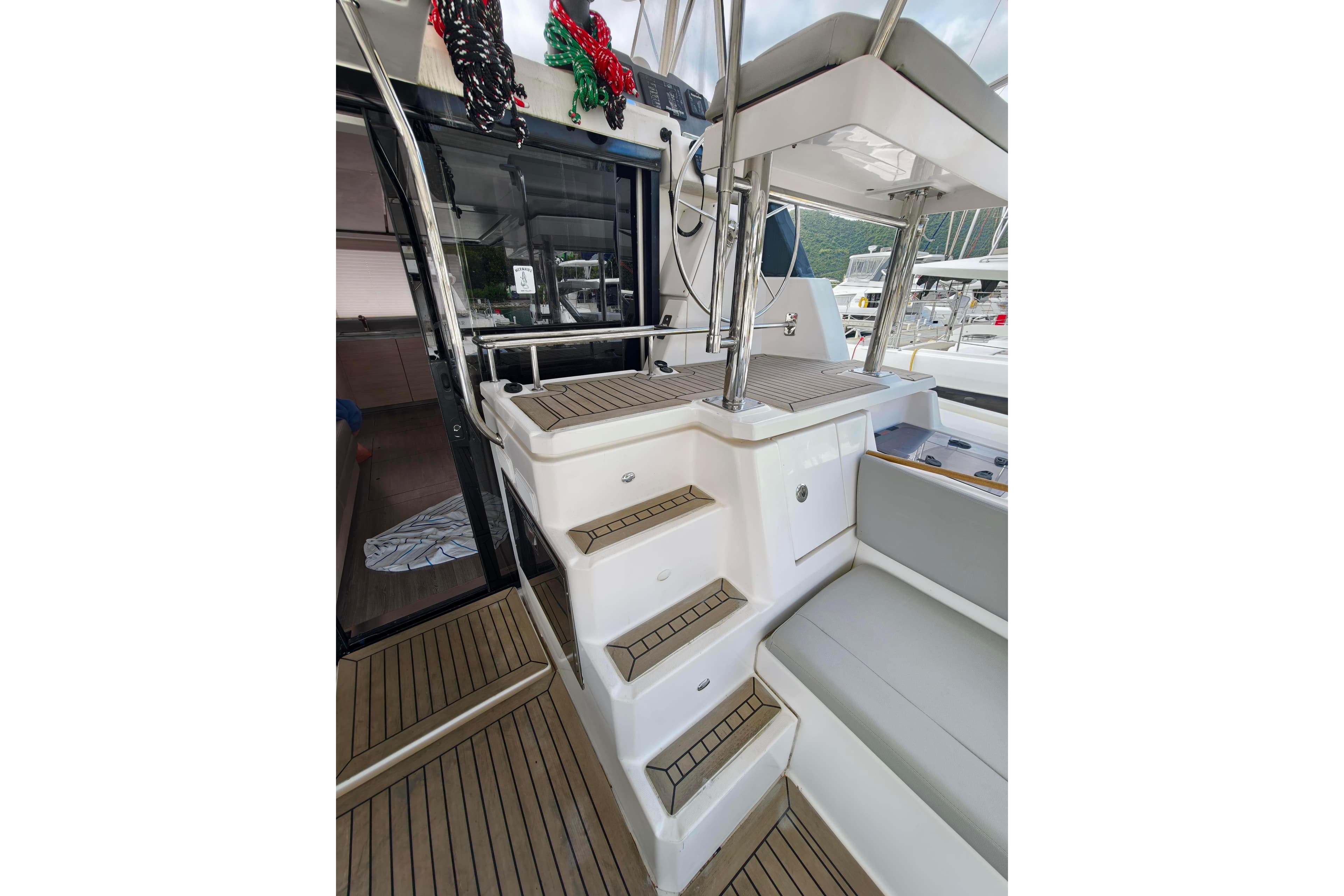 2019 Leopard 50 yacht interior with stairs and seating area.