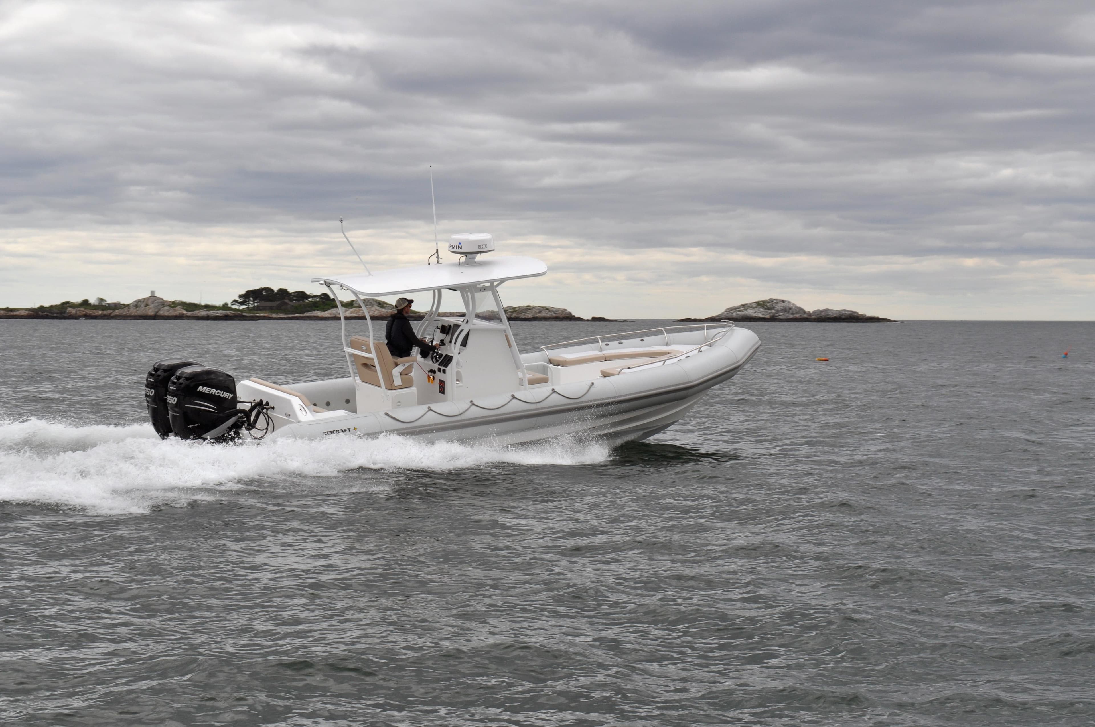 2024 Ribcraft 9.0 boat cruising on open water under cloudy skies.