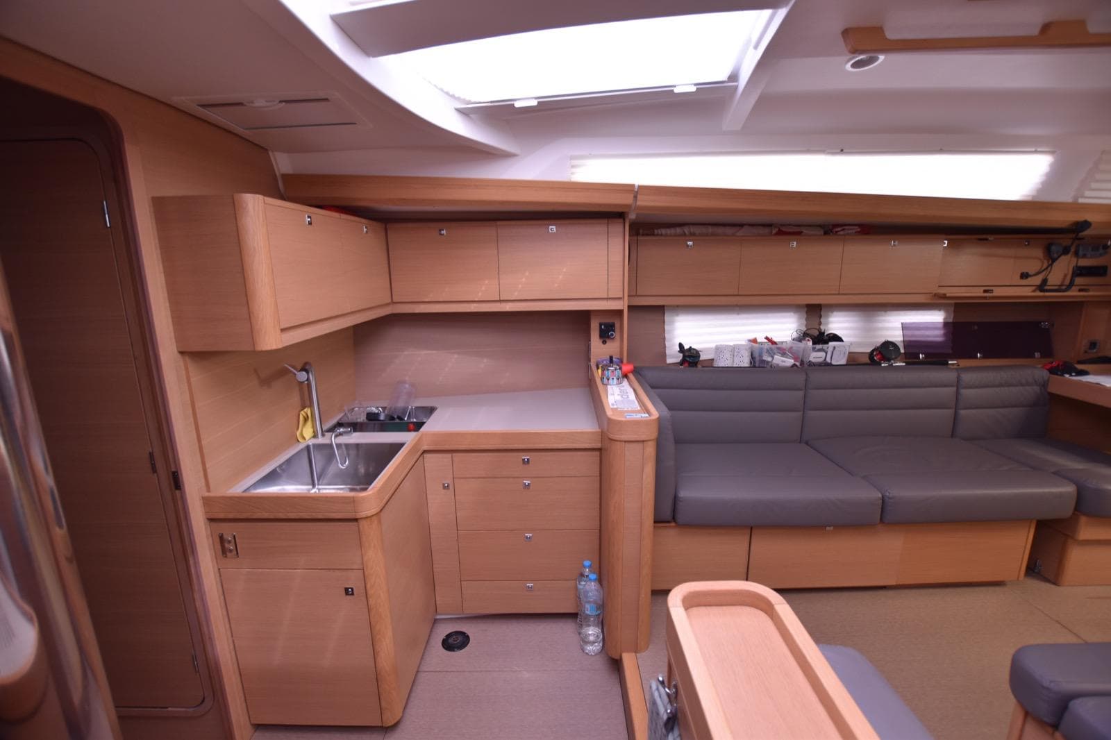 Interior of 2015 Dufour 500 Grand Large yacht, featuring modern kitchen and seating area.
