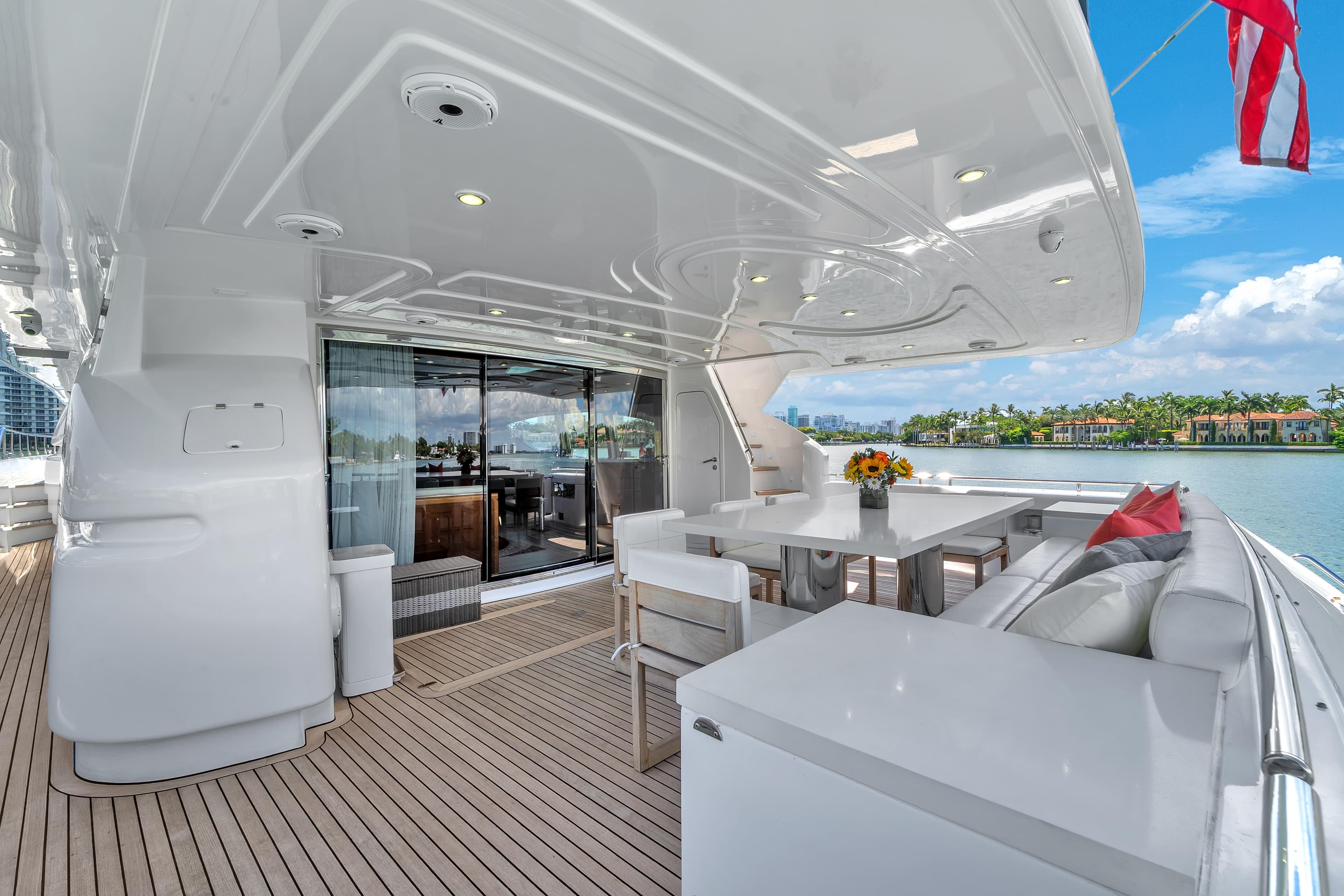 Luxurious 2002 Ferretti Yachts Custom Line 94 deck with elegant seating and ocean view.
