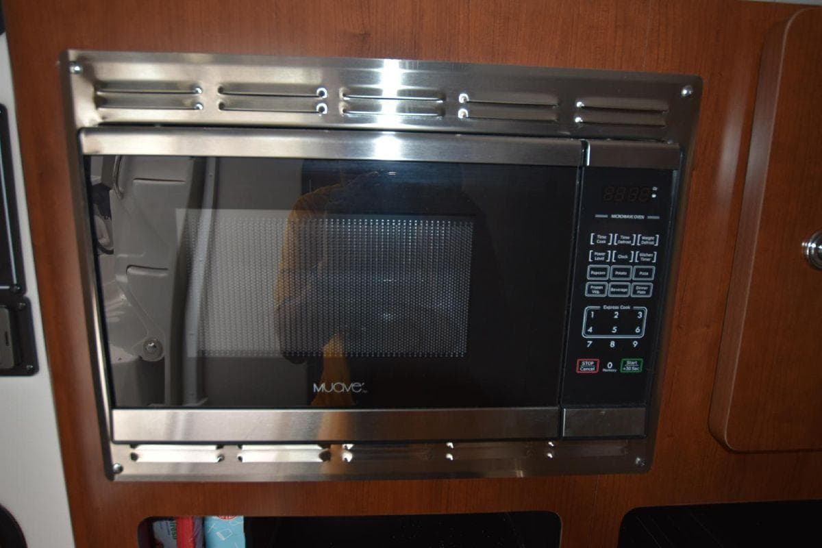 Built-in microwave in 2021 Crownline 264 CR boat galley.