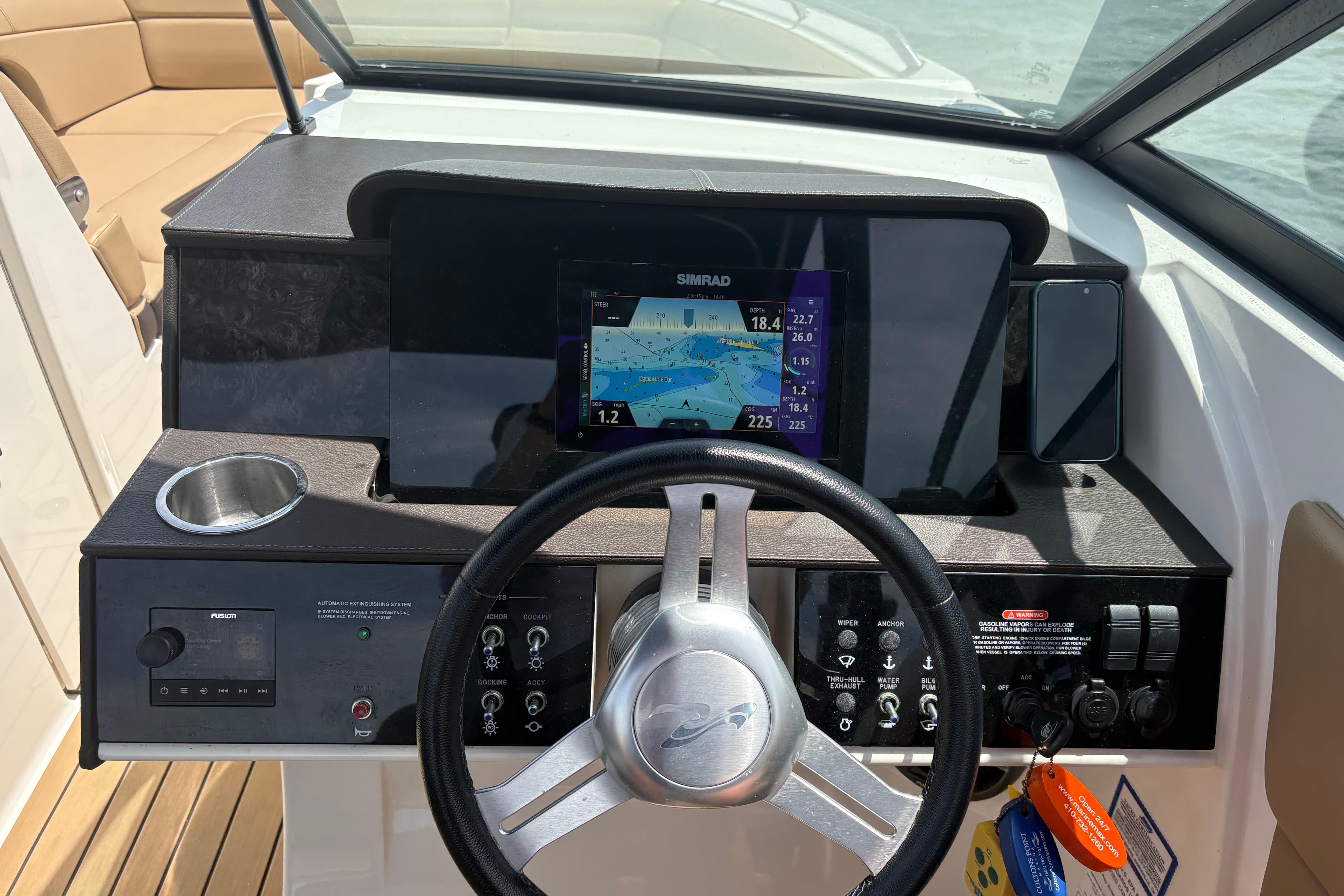 2021 Sea Ray SDX 270 dashboard with steering wheel, navigation display, and controls.
