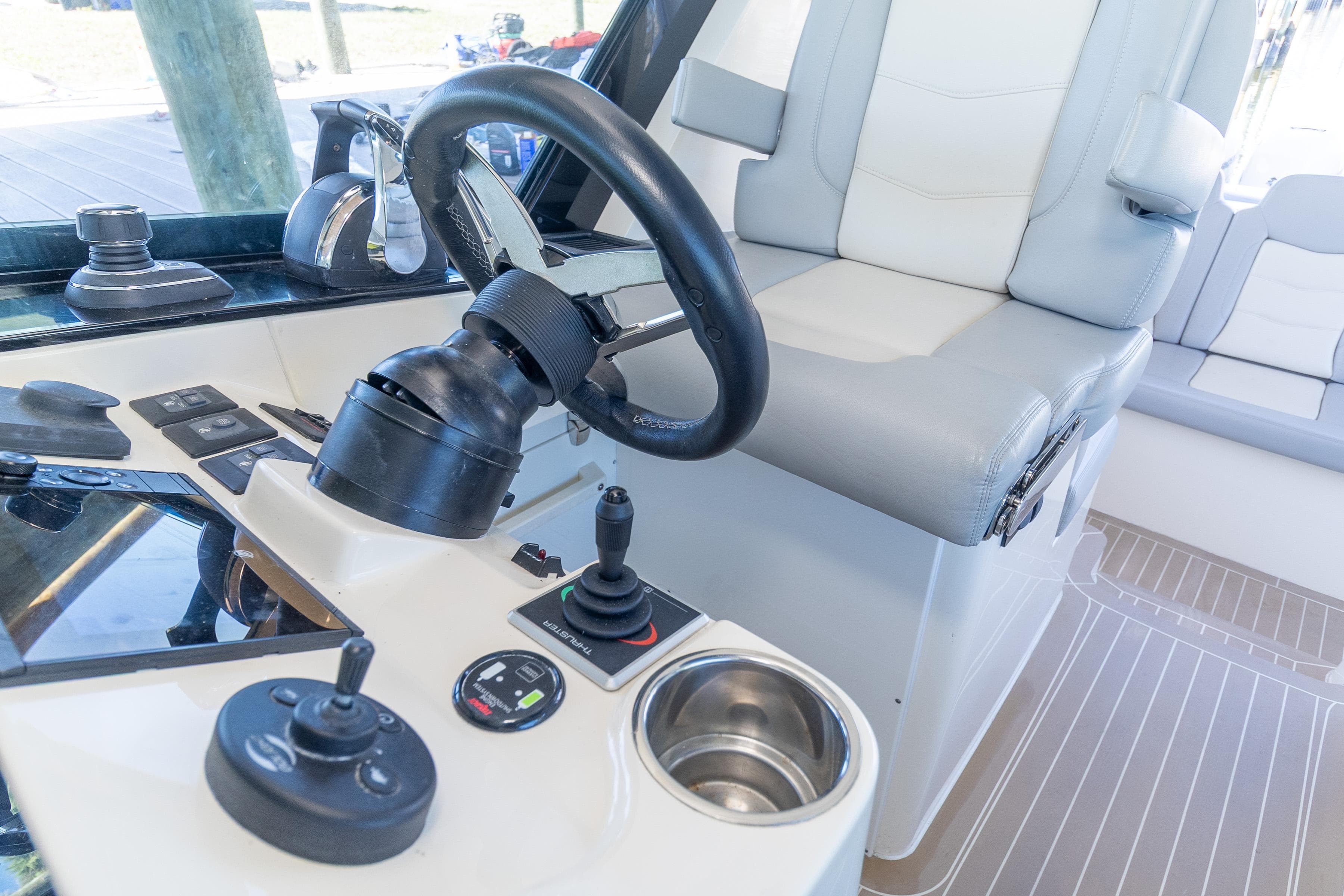 2020 Scout 530LXF boat helm with steering wheel and controls.