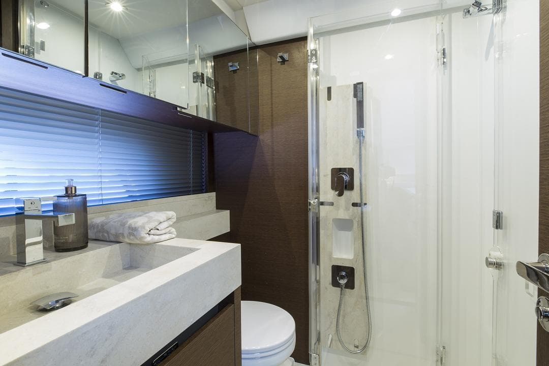 Manufacturer Provided Image: Modern bathroom in 2023 Prestige 520 S yacht with sleek fixtures and glass shower.
